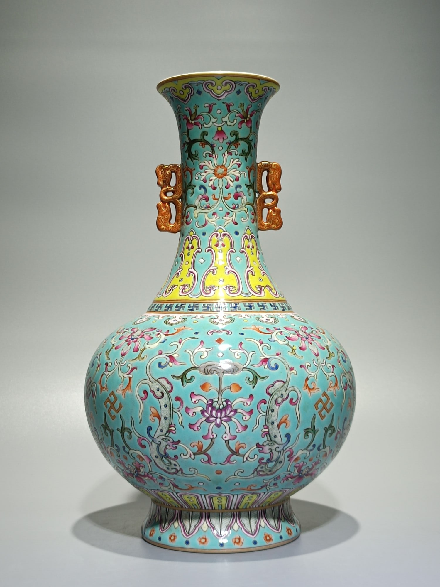 An Exquisite Famille-Rose Turquoise Glazed Lotus Pattern Double-Ears Vase: An Exquisite Famille-Rose Turquoise Glazed Lotus Pattern Double-Ears Vase,Qing Dynasty,China,Qianlong Six-character Mark,Size:11.4inx6.9in 粉彩松石绿釉缠ĉ