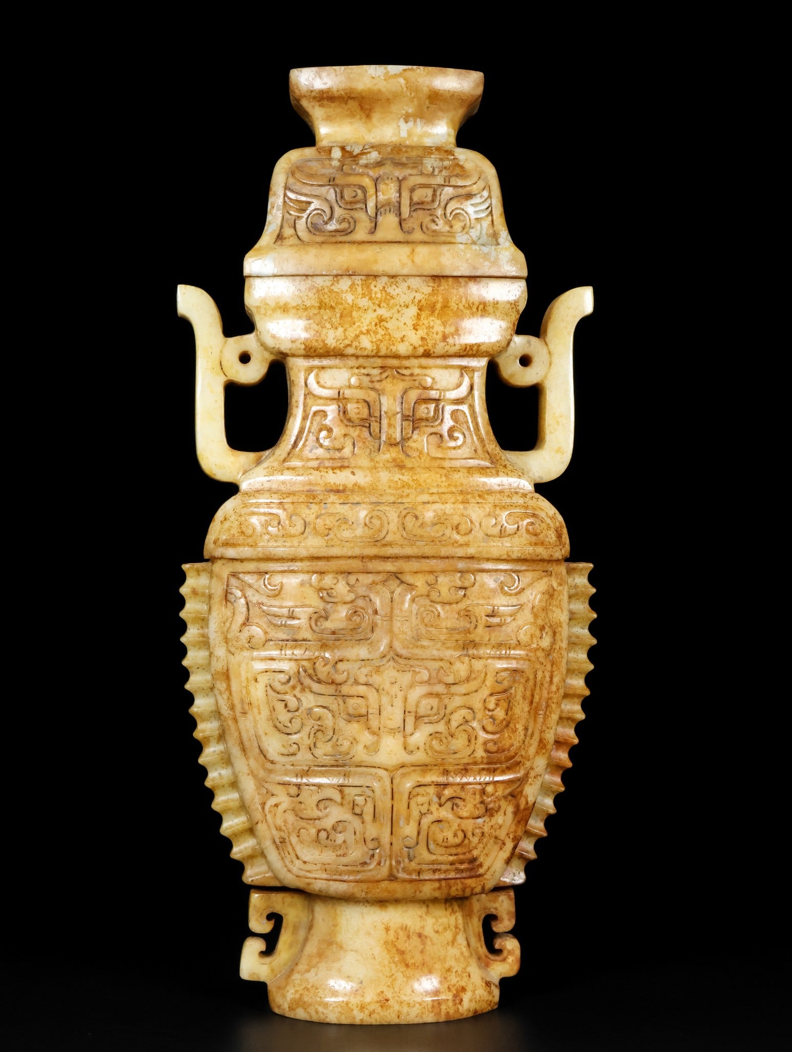 An Exquisite Archaic Jade Beast-Face Pattern Double-Ears Bottle (1 of 9)