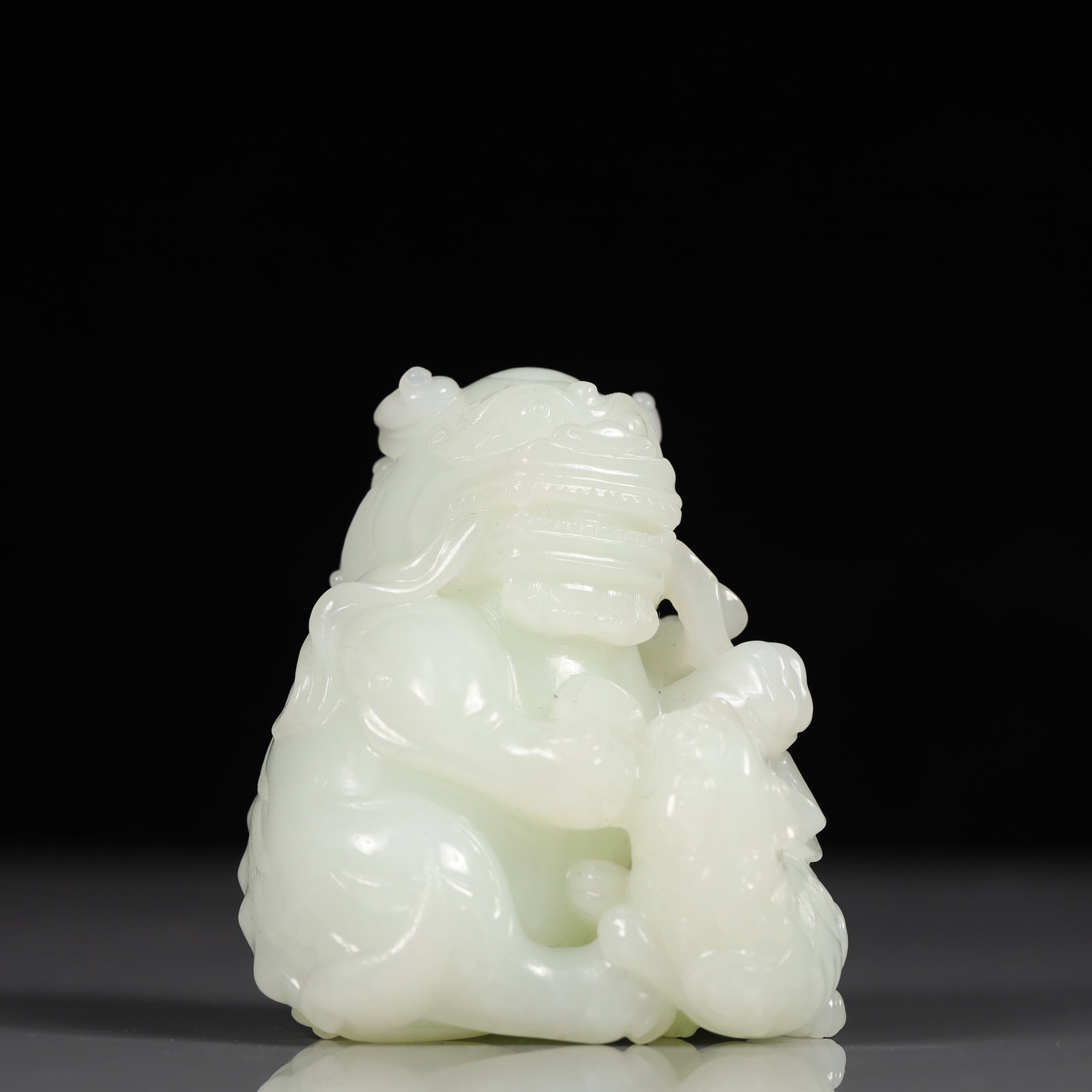 An Exquisite White Jade Figure and Lion Ornament: An Exquisite White Jade Figure and Lion Ornament, Qing Dynasty, China, Size:2.4inx2inx3in, Weight:293g 精美的白玉人物狮子摆件,中
