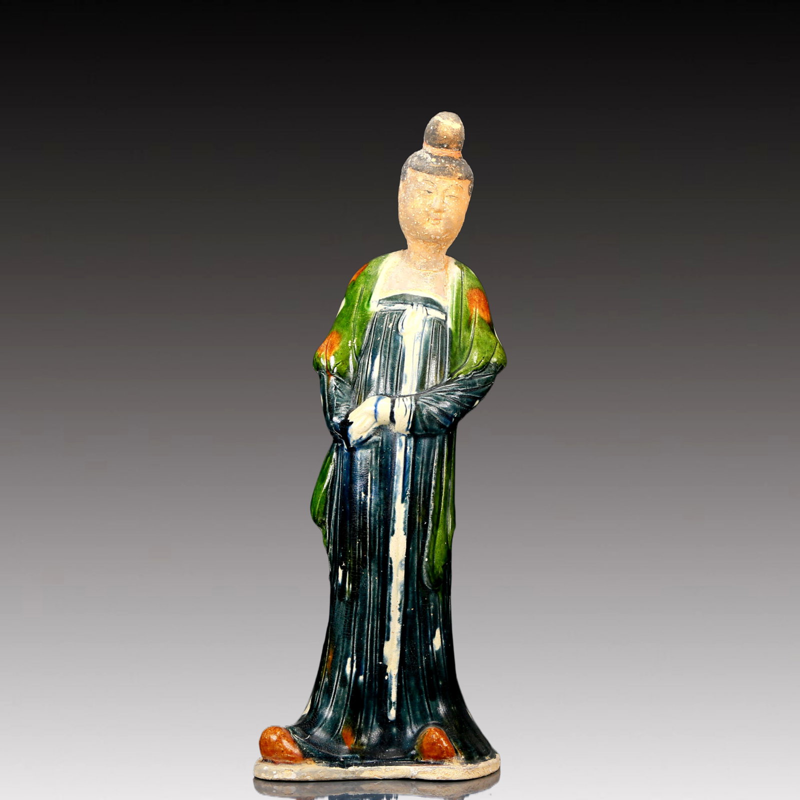 A Rare Tang Tri-Color Glazed Pottery Woman Ornament: A Rare Tang Tri-Color Glazed Pottery Woman Ornament,Tang Dynasty, China,Chinese Tang Tri-colored Pottery, or Tang Sancai, flourished during the Tang Dynasty (618–907 AD). It's renowned for its v