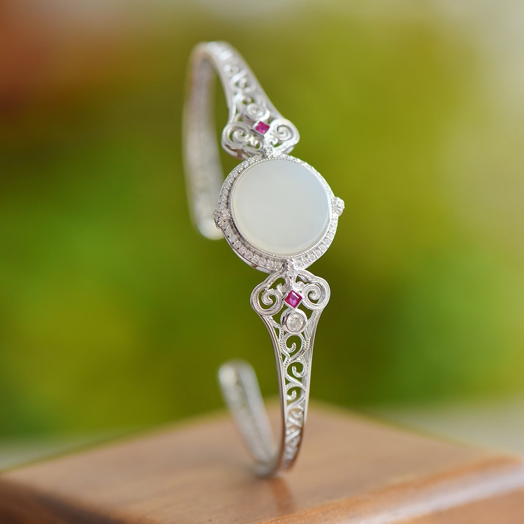 An Exquisite Sterling Silver Inlaid White Jade Bracelet: An Exquisite Sterling Silver Inlaid White Jade Bracelet 纯银镶白玉手镯