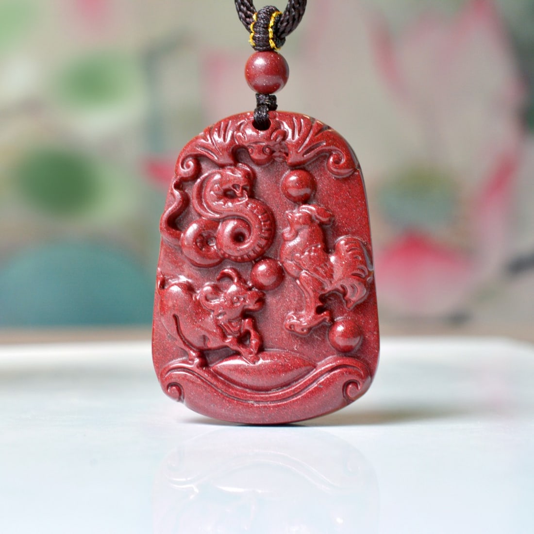An Exquisite Cinnabar Animal Pattern Pendant: An Exquisite Cinnabar Animal Pattern Pendant,Size:1.2inx1.7in,Weight:35.26g 朱砂动物纹挂件