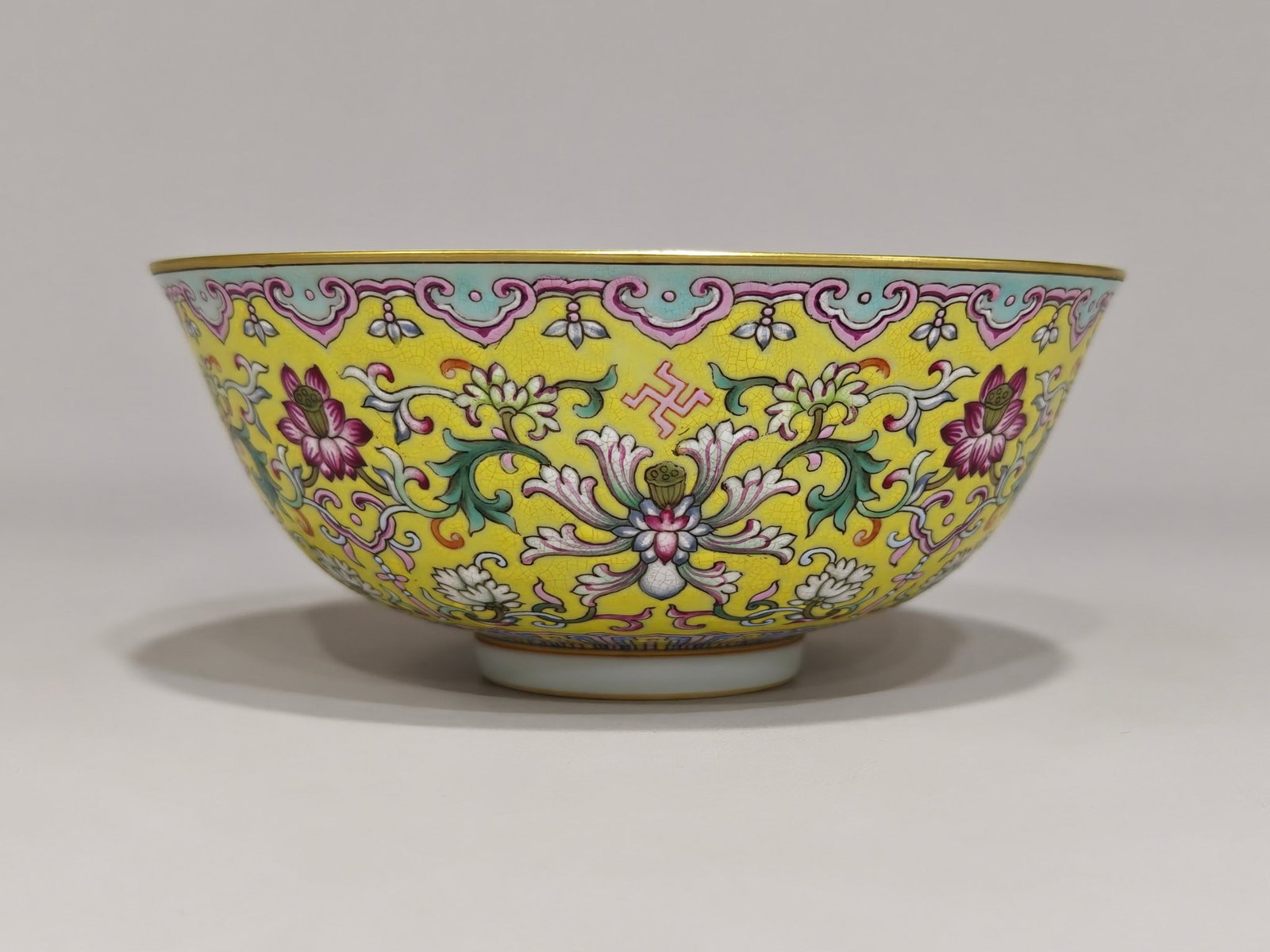 An Exquisite Yellow Ground Famille-Rose Lotus Pattern Bowl: An Exquisite Yellow Ground Famille-Rose Lotus Pattern Bowl,Qing Dynasty,China,Tongzhi Six-character Mark,Size:2.6inx6.1in 黄地粉彩缠枝莲纹碗,È