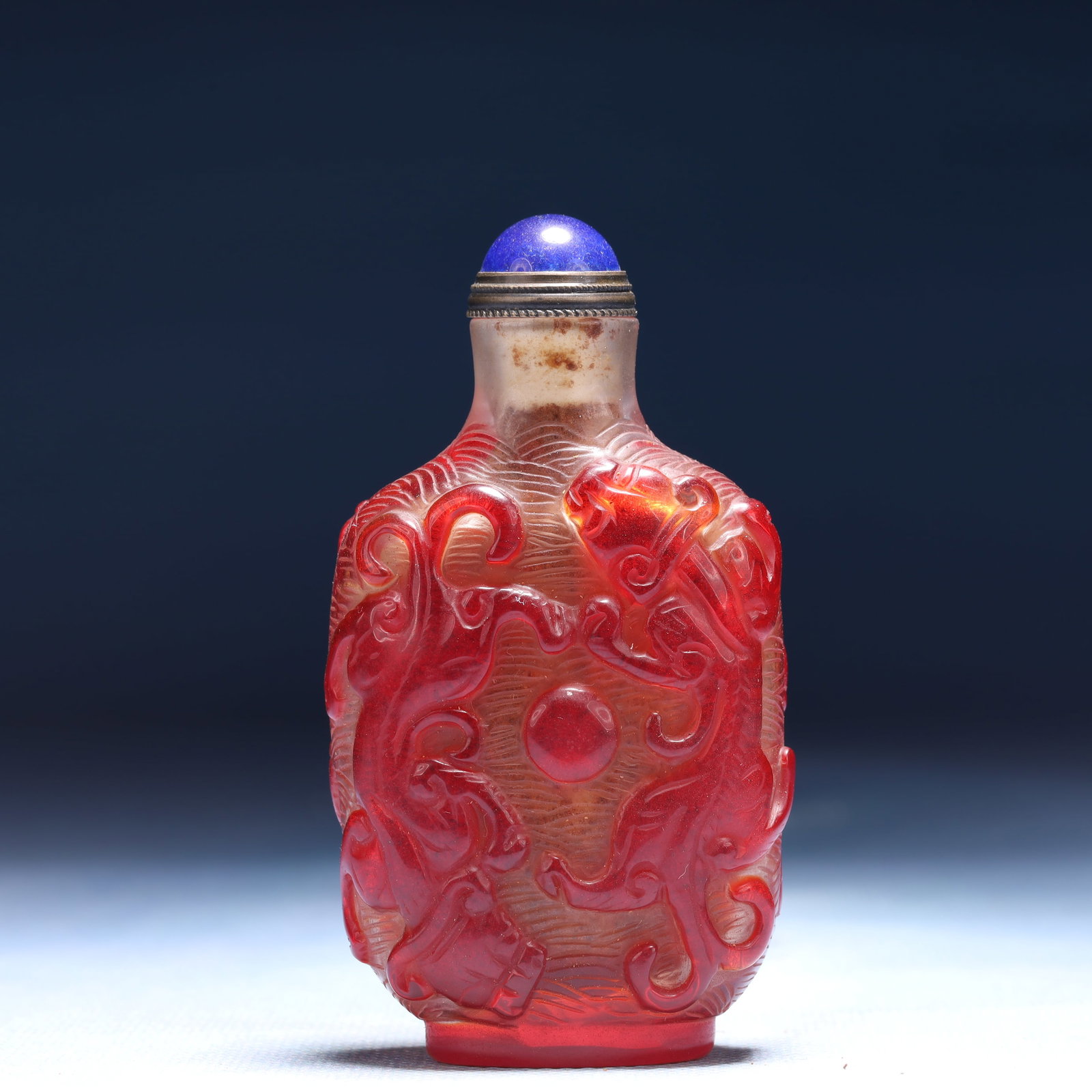 An Exquisite Glass Chi-Dragon Pattern Snuff Bottle: An Exquisite Glass Chi-Dragon Pattern Snuff Bottle,Qing Dynasty,China,Size:1.8inx1inx3.3in,Weight:74g 琉璃螭龙纹鼻烟壶,中国清代