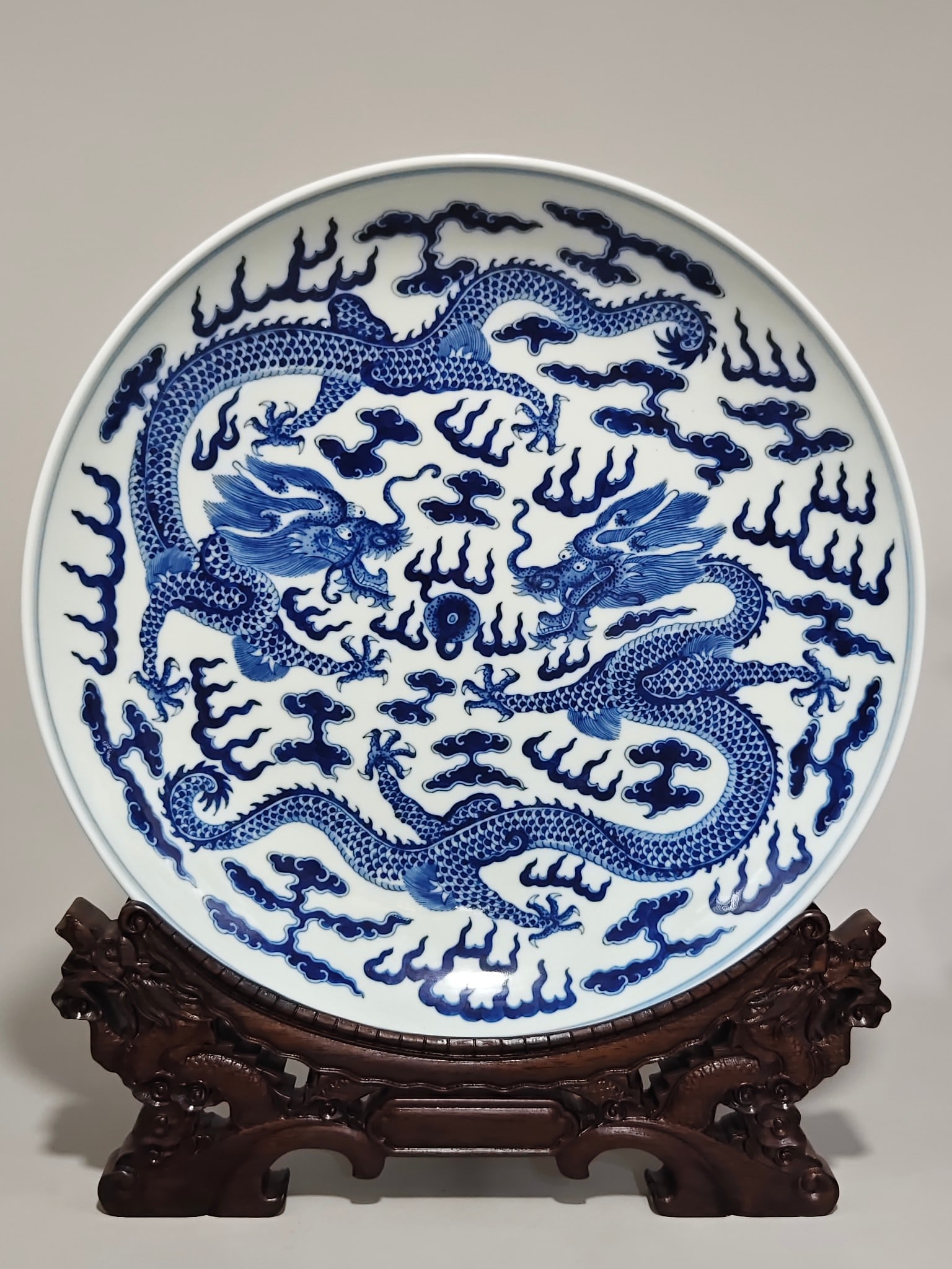 An Exquisite Blue and White Auspicious Cloud and Dragon Pattern Plate: An Exquisite Blue and White Auspicious Cloud and Dragon Pattern Plate,Qing Dynasty,China,Xuantong Six-character Mark,Size:2.6inx13.6in 青花祥云龙纹盘子,