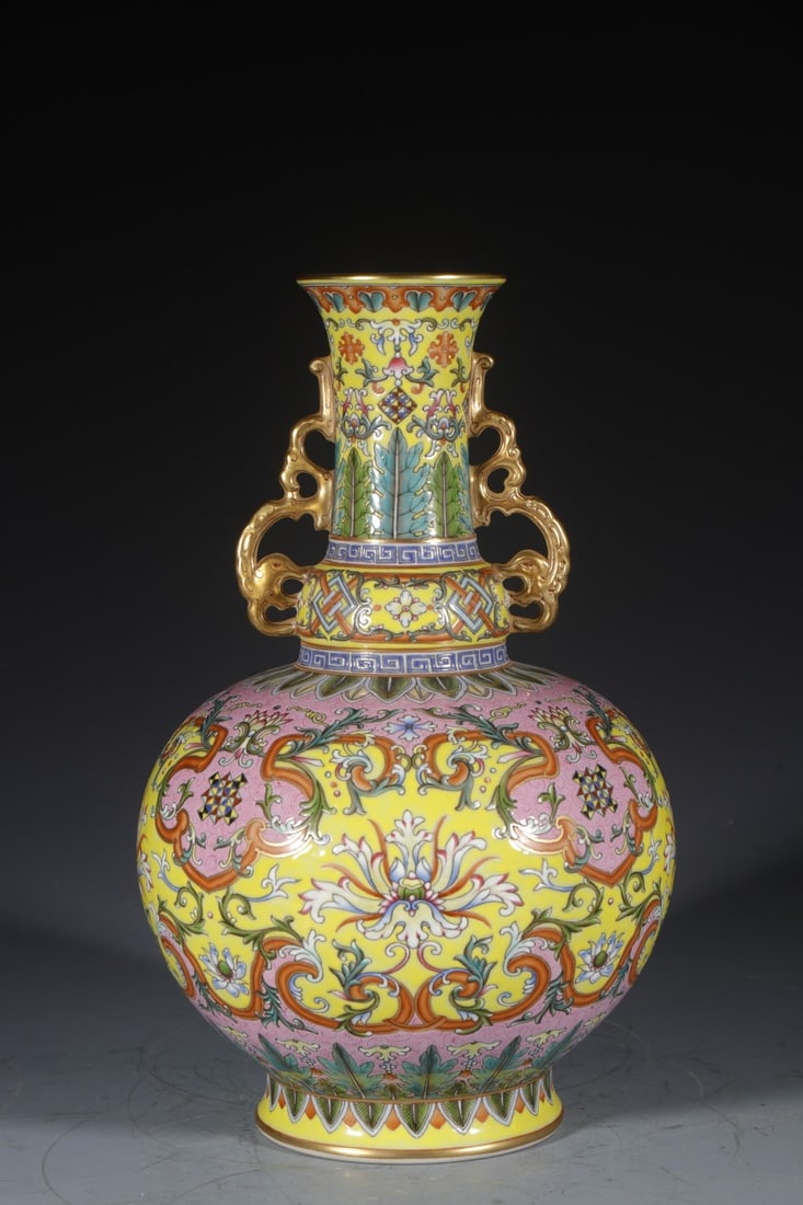 A Rare Yellow Ground Enamel Lotus Pattern Double-Ears Vase: A Rare Yellow Ground Enamel Lotus Pattern Double-Ears Vase,Qing Dynasty,China,Qianlong Six-character Mark,Size:12.6inx4.7in 黄地珐琅彩缠枝莲纹