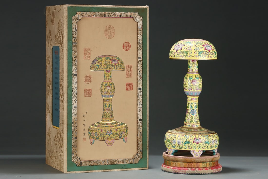 A Rare Yellow Ground Famille-Rose Lotus Pattern Hatstand: A Rare Yellow Ground Famille-Rose Lotus Pattern Hatstand,Qing Dynasty,China,Qianlong Four-character Mark,Size:14.8inx7.1in 黄地粉彩缠枝莲纹帽ĉ