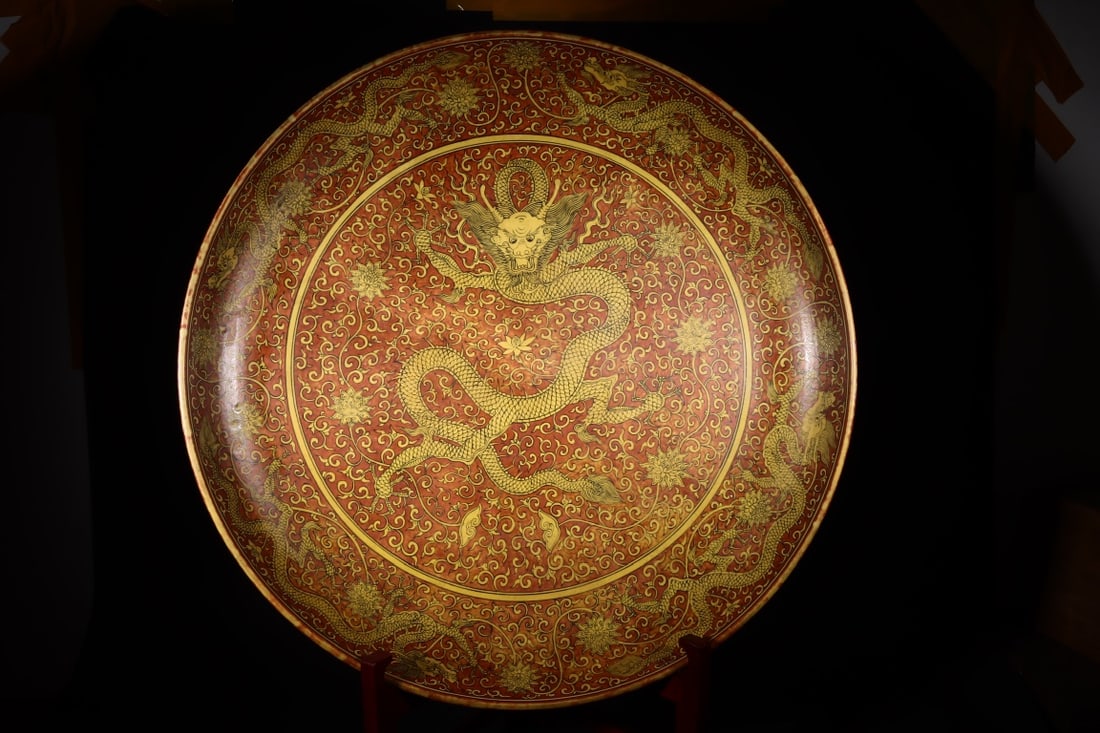 An Exquisite Red Ground Yellow Glazed Lotus and Dragon Pattern Plate: An Exquisite Red Ground Yellow Glazed Lotus and Dragon Pattern Plate,Ming Dynasty,China,Jiajing Six-character Mark,Size:4.3inx30.7in 红地黄釉缠枝莲龙