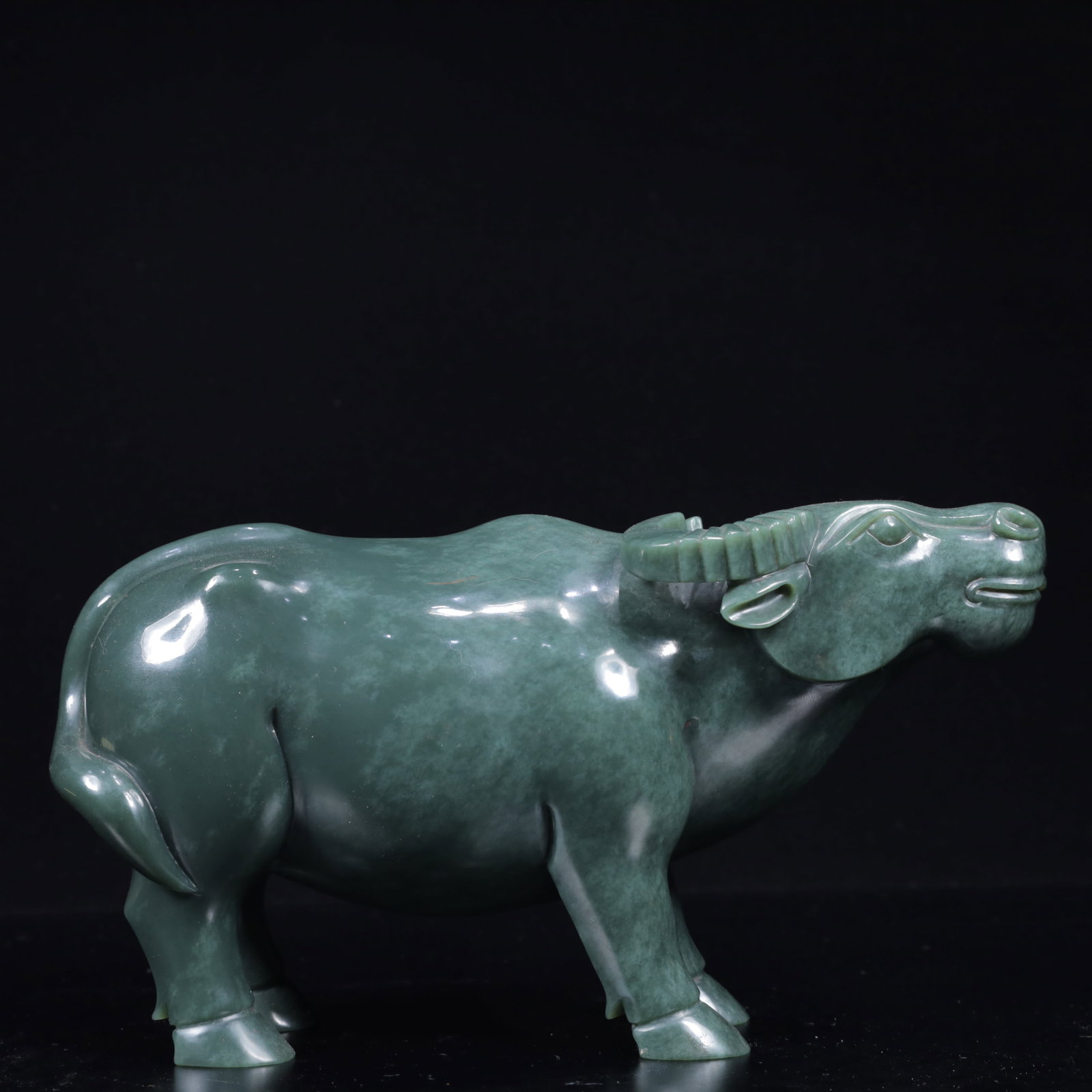 An Exquisite Jasper Buffalo Pattern Ornament: An Exquisite Jasper Buffalo Pattern Ornament,Qing Dynasty, China,Size:9.1inx2.8inx4.7in,Weight:2750g 碧玉牛纹摆件,中国清代