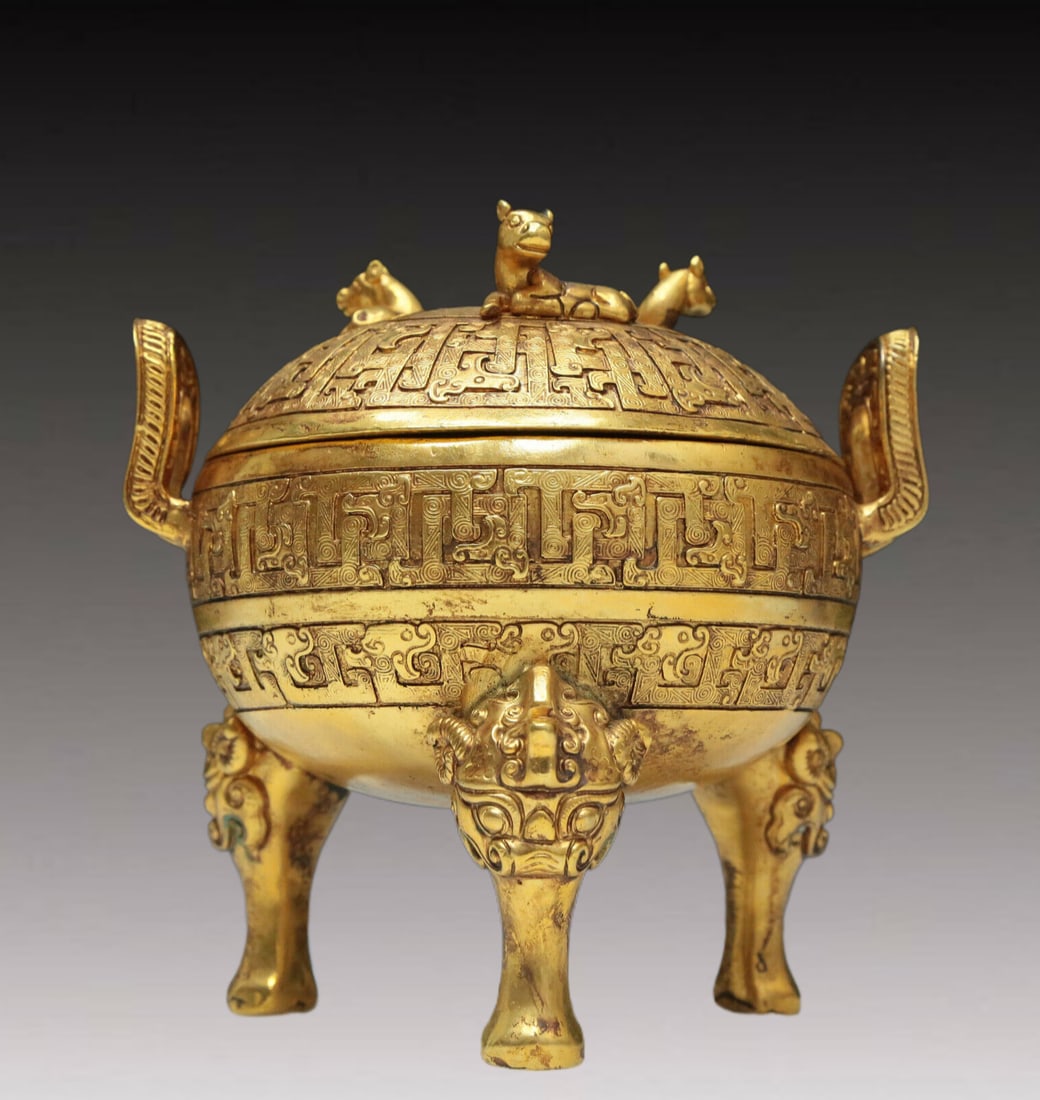 A Magnificent Gilt-Bronze 'Dragon' Tripod Censer And Cover: A Magnificent Gilt-Bronze 'Dragon' Tripod Censer And Cover. Raised on three feet issuing from animal masks, body cast with archaistic motifs. Chinese Ming Dynasty. Xuande Four-Character Mark. Size:5.7