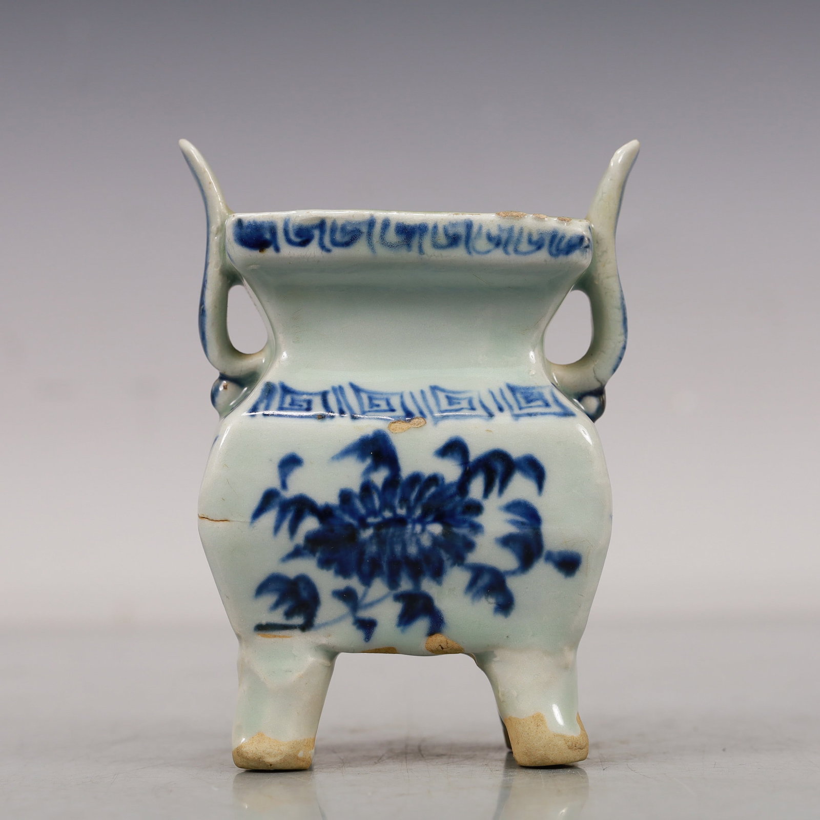 A Blue And White 'Scrolling Lotus' Censer: A Blue And White 'Scrolling Lotus' Censer. Carved with flaring handles,and is painted in deep cobalt blue with angular scrolls. Chinese Yuan Dynasty. Size:3.5inx2.2inx4.7in 元代 青&#