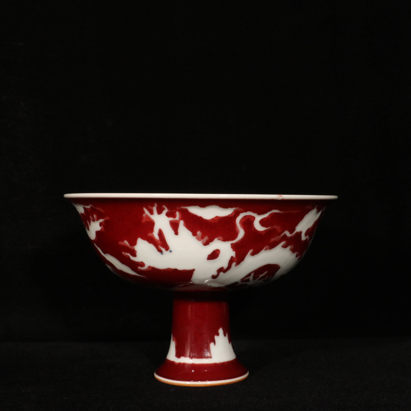 An Exquisite Ji Red Glazed Auspicious Cloud and Dragon Pattern Stem Bowl: An Exquisite Ji Red Glazed Auspicious Cloud and Dragon Pattern Stem Bowl,Ming Dynasty,China,Xuande Six-character Mark,Size:4.5inx6.7in 霁红釉祥云龙纹高&