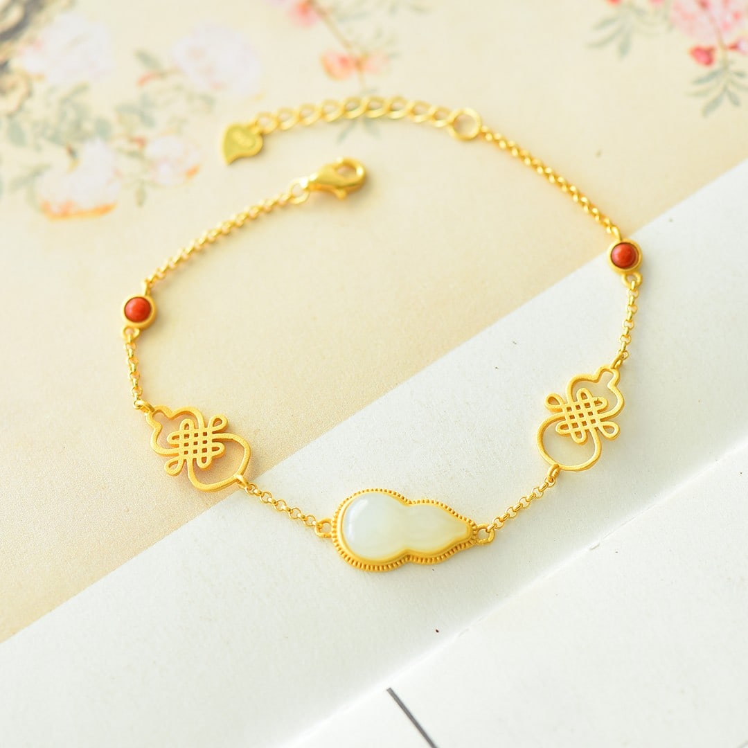 An Exquisite Sterling Silver-Gold Plated Inlaid White Jade Bracelet: An Exquisite Sterling Silver-Gold Plated Inlaid White Jade Bracelet 纯银镀金镶白玉手链