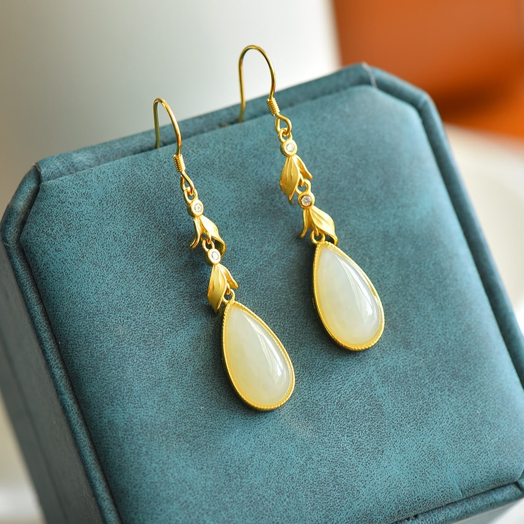 A Pair of Exquisite Sterling Silver-Gold Plated Inlaid White Jade Earrings , Inlaid Diamonds: A Pair of Sterling Silver-Gold Plated Inlaid White Jade Earrings , Inlaid Diamond , Size :0.3inx0.6ins 一对纯银镀金镶白玉耳环,嵌