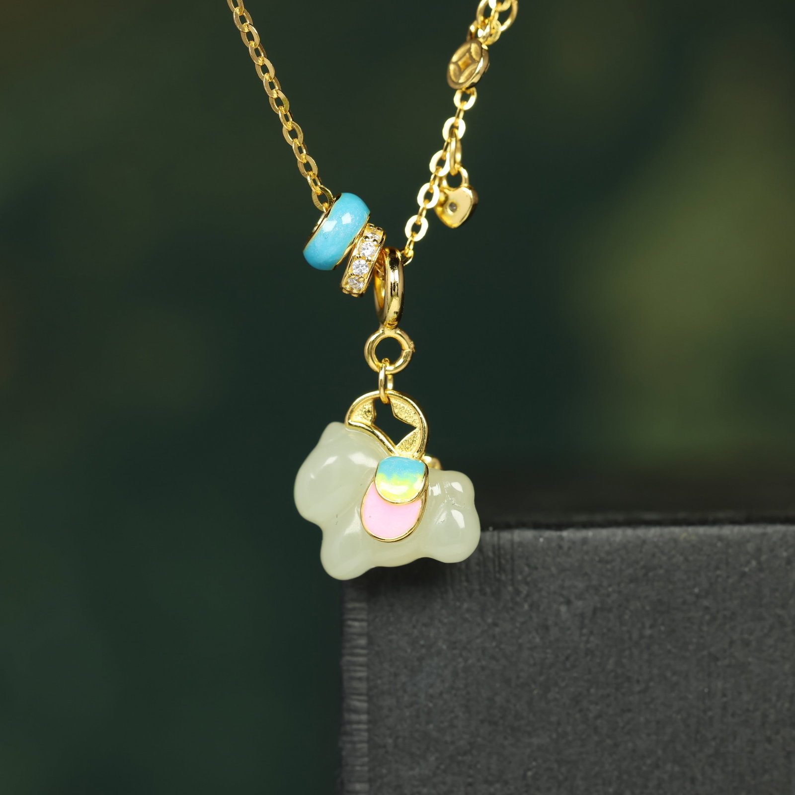 An Exquisite Sterling Silver-Gold Plated Inlaid White Jade Pendant , Inlaid Diamond: Sterling Silver-Gold Plated Inlaid White Jade Pendant , Inlaid Diamond , Size :0.4inx0.5in 纯银镀金镶白玉吊坠,嵌钻石,尺