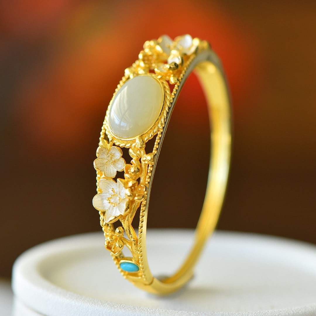 An Exquisite Sterling Silver-Gold Plated Inlaid White Jade Enamel Bracelet: An Exquisite Sterling Silver-Gold Plated Inlaid White Jade Enamel Bracelet,Size:0.5inx0.7in 纯银镀金镶白玉珐琅手镯