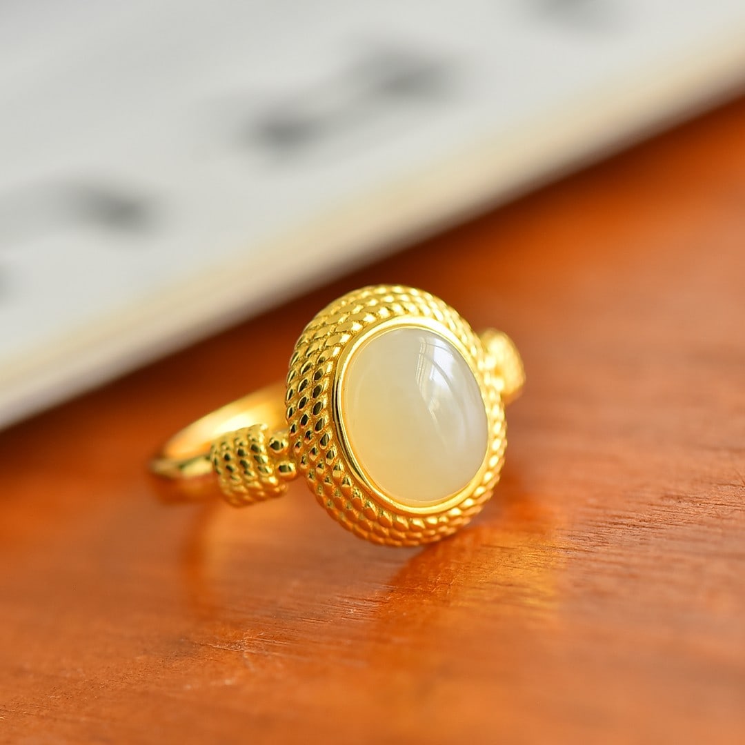 An Exquisite Sterling Silver-Gold Plated Inlaid White Jade Ring: Sterling Silver-Gold Plated Inlaid White Jade Ring , Size :0.3inx0.4in 纯银镀金镶白玉戒指,尺寸:0.3inx0.4in