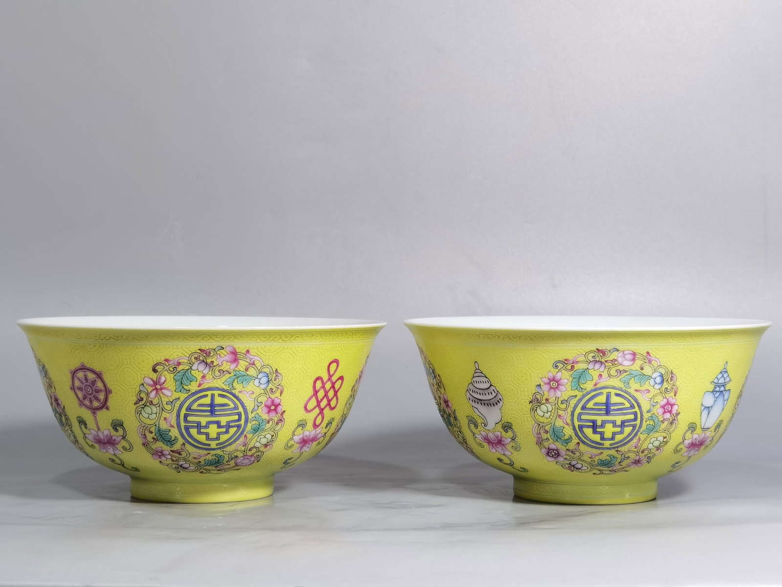 A Pair of Exquisite Yellow Ground Enamel Eight Treasures Pattern Bowls: A Pair of Exquisite Yellow Ground Enamel Eight Treasures Pattern Bowls,Qing Dynasty,China,Qianlong Four-character Mark,Size:5.9inx2.8in 