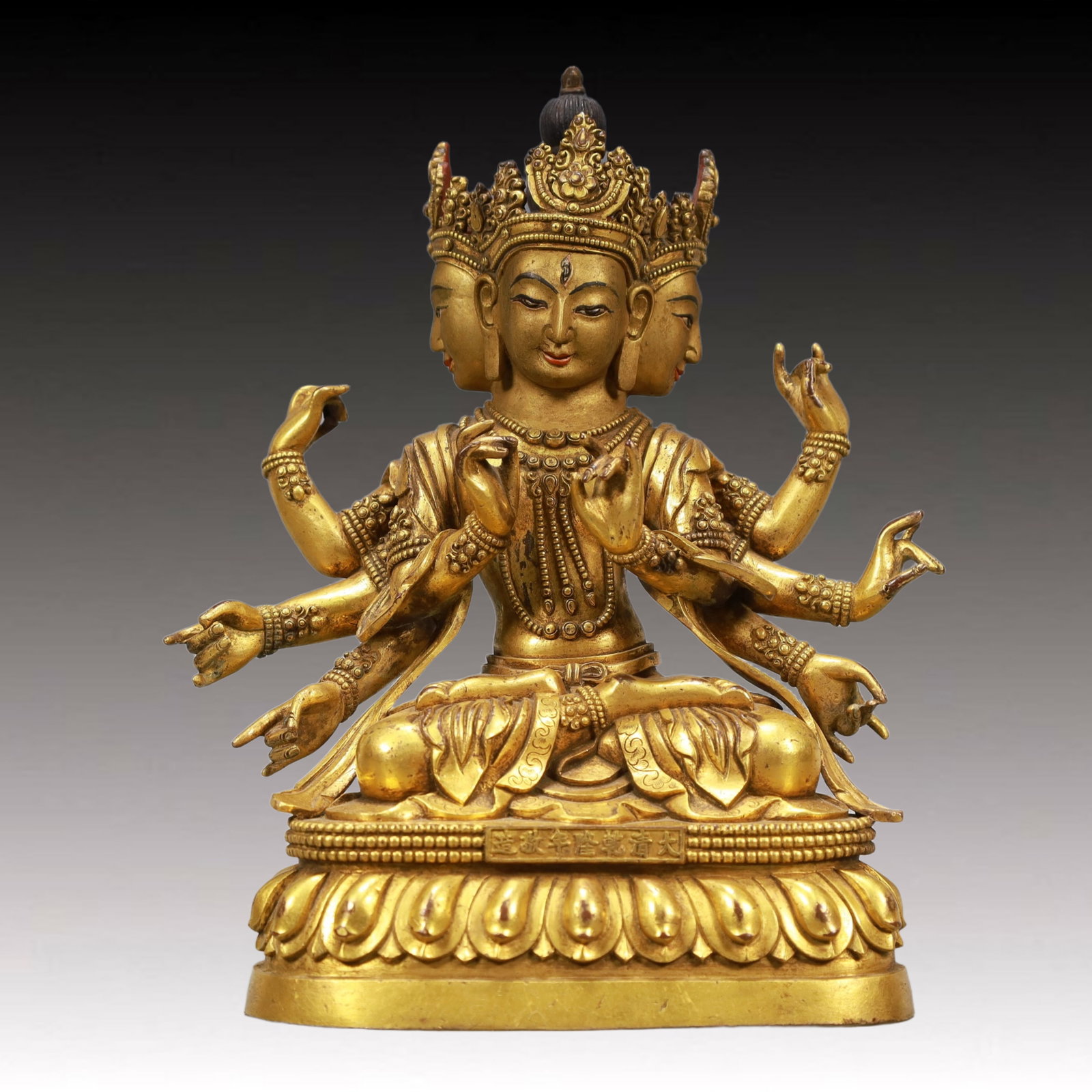 A Solemn Gilt Bronze Statue of Three-Headed and Eight-Armed Guanyin: A Solemn Gilt Bronze Statue of Three-Headed and Eight-Armed Guanyin ,Qing Dynasty, China,Qianlong Seven-character Mark,Size:7.1inx3.5inx8.3in,Weight:2550g 铜鎏金三头Ð