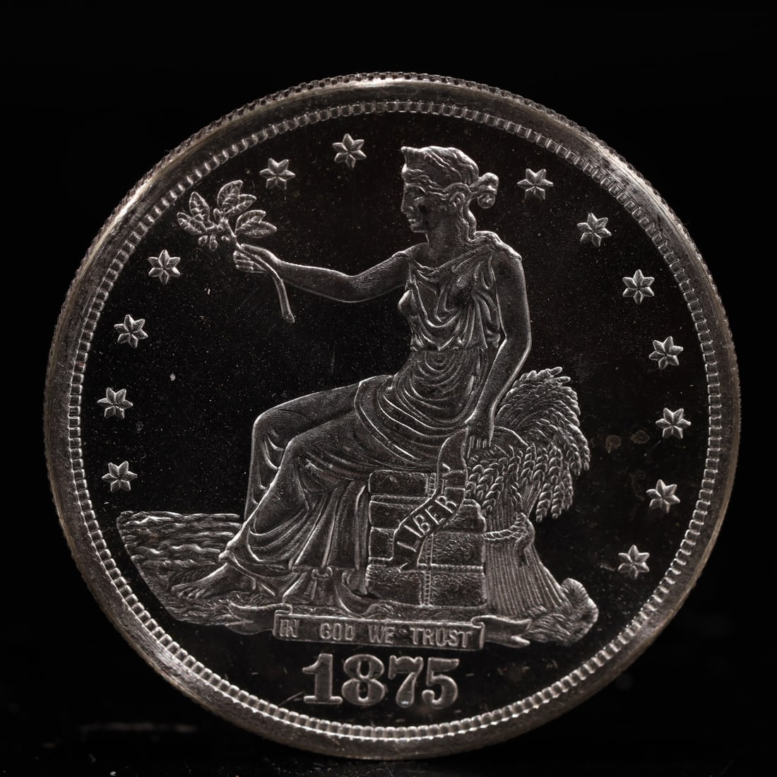 USA Trade Dollar 1875 Coin: American coin. Obverse: Liberty seated on a pedestal facing the sea to the left holding olive branches surrounded by 13 stars. IN GOD WE TRUST / LIBERTY / 1875. Reverse: An eagle holding branches with