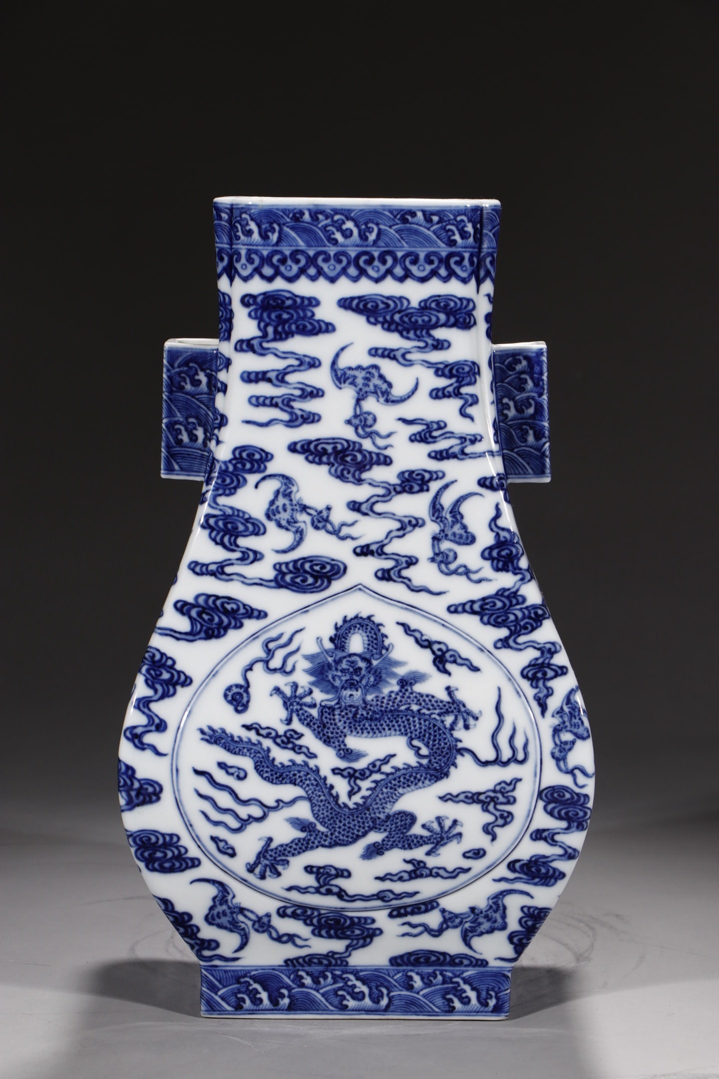 A Rare Blue and White Auspicious Cloud and Dragon Pattern Double-Ears Vase: A Rare Blue and White Auspicious Cloud and Dragon Pattern Double-Ears Vase,Qing Dynasty,China,Qianlong Six-character Mark,Size:14in 青花祥云龙纹双耳
