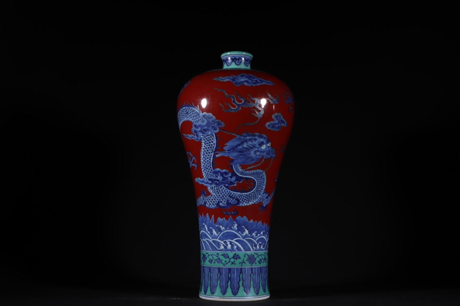 A Rare Red Glazed Blue and White Seawater and Dragon Pattern Vase: A Rare Red Glazed Blue and White Seawater and Dragon Pattern Vase,Qing Dynasty,China,Qianlong Six-character Mark,Size:14.2inx7.1in 红釉青花海水龙纹ī