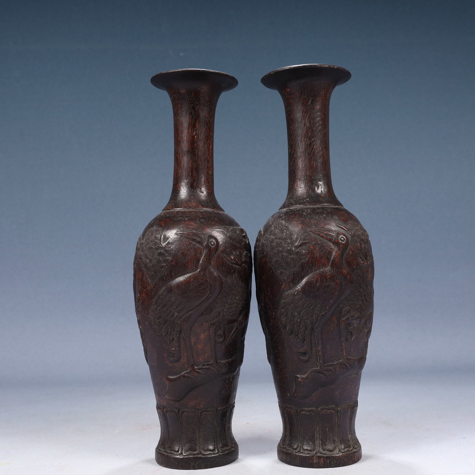 A Pair of Rare Zitanwood Pine and Crane Pattern Vases: A Pair of Rare Zitanwood Pine and Crane Pattern Vases,Qing Dynasty, China,Size:3.5inx11.8in,Weight:650g 一对紫檀木松鹤纹瓶,中国清