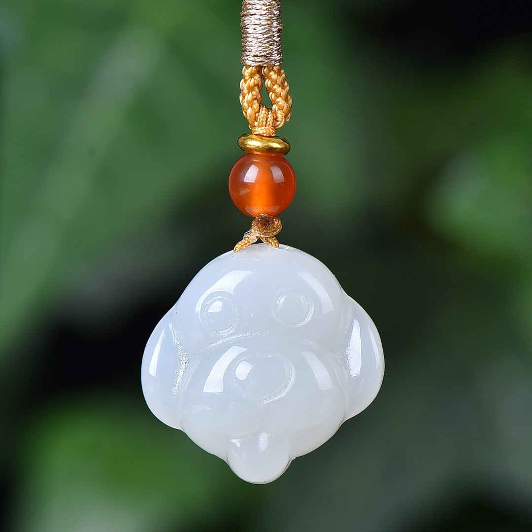 An Exquisite White Jade Dog Pendant (1 of 4)