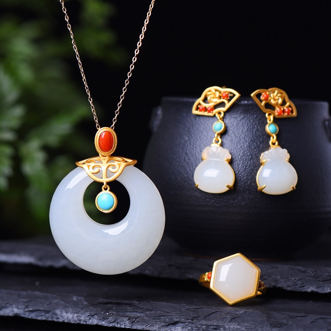 A Set of Fine Sterling Silver-Gold Plated Inlaid White Jade Jewelrys: A Set of Fine Sterling Silver-Gold Plated Inlaid White Jade Jewelrys,Size:(Pendant)1.6inx1.6in,(Earrings)0.5inx0.6in,(Ring)0.6inx0.6in 一套纯银镀金镶白&