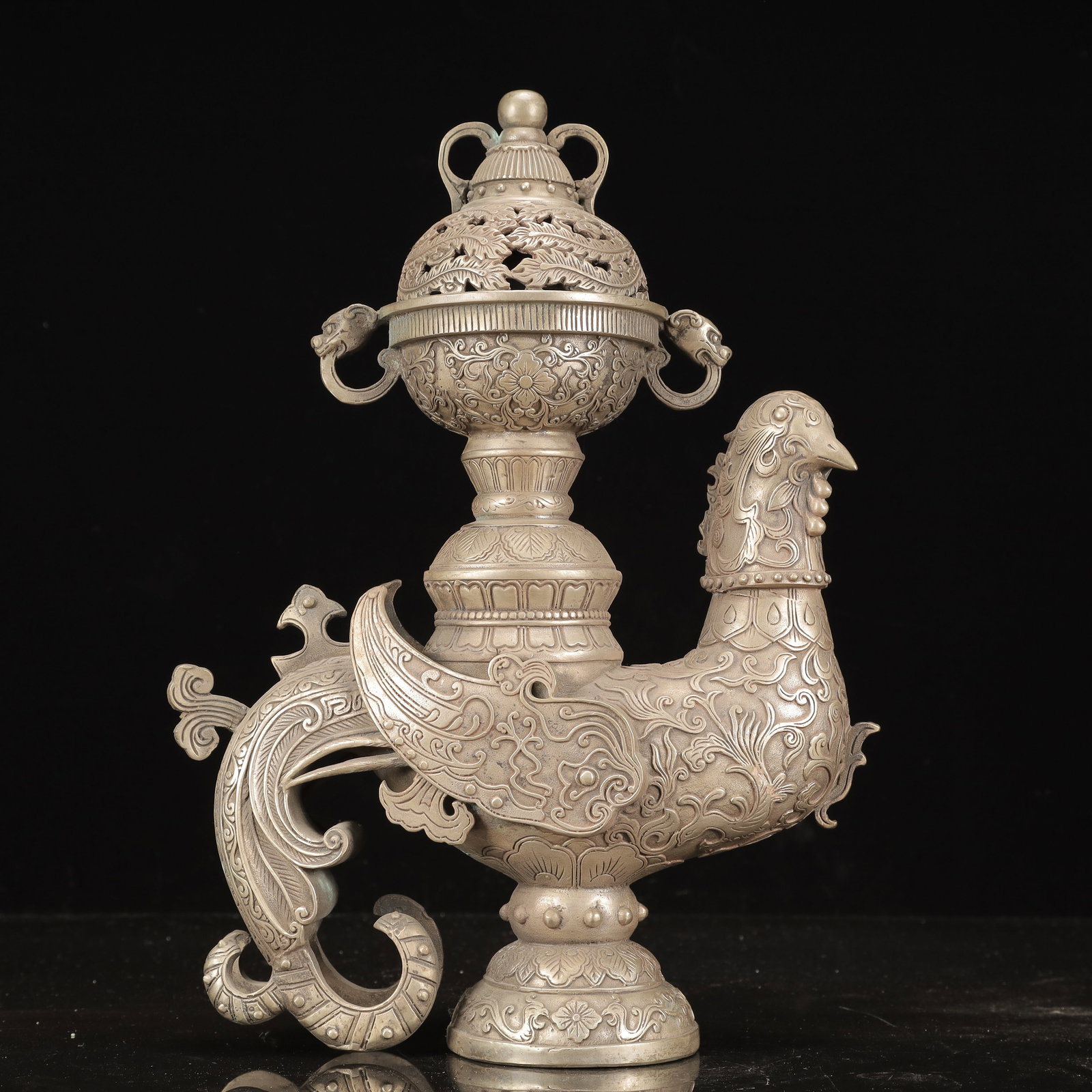 A Rare Silver-Plated Bronze Flower Pattern Phoenix-Shaped Censer: A Rare Silver-Plated Bronze Flower Pattern Phoenix-Shaped Censer,Qing Dynasty, China, Qianlong Four-character Mark,Size:11inx4.3inx14.6in,Weight:4300g 