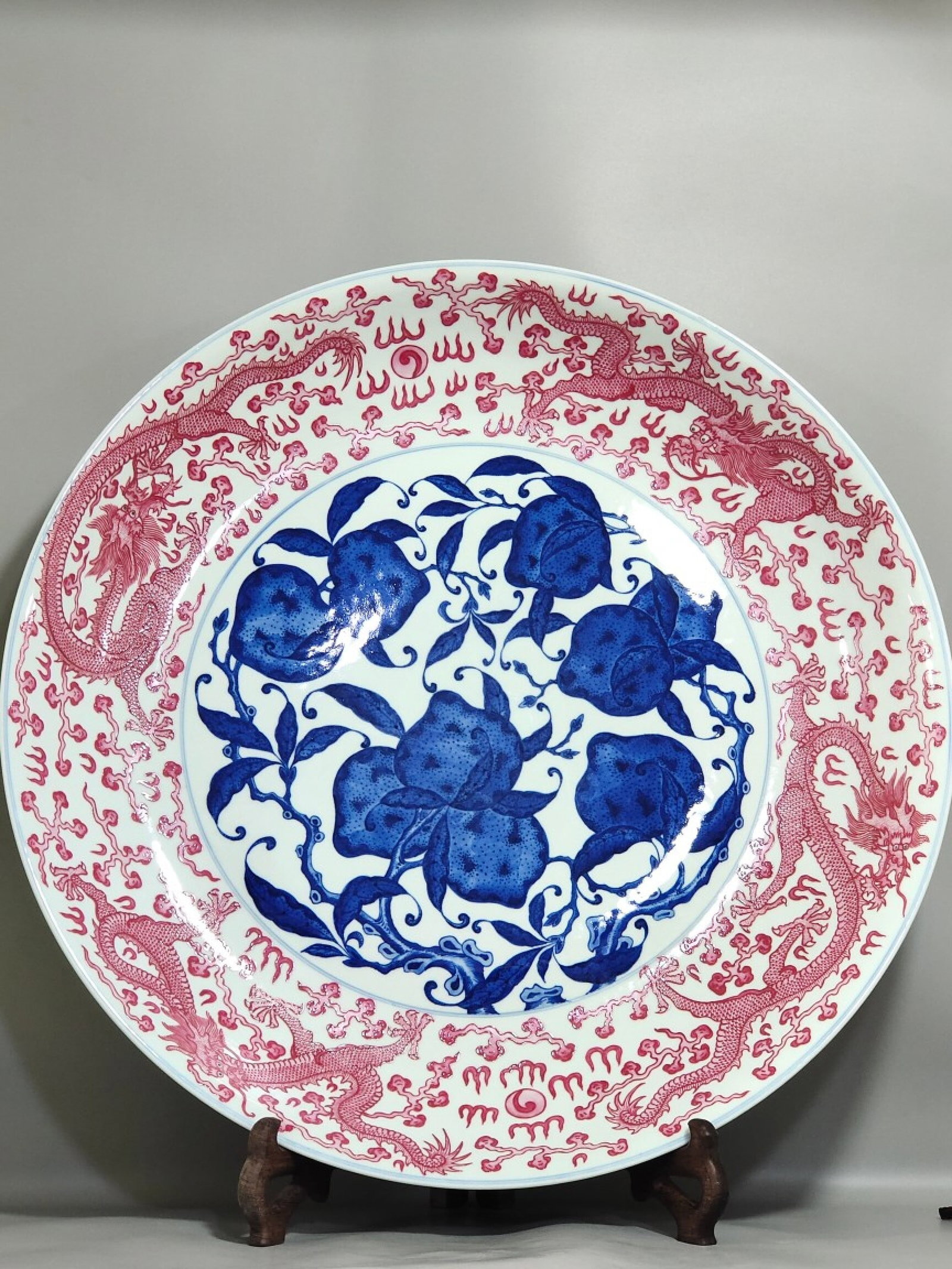 A Huge Blue and White Ruby Red-Glazed Peach and Dragon Pattern Plate: A Huge Blue and White Ruby Red-Glazed Peach and Dragon Pattern Plate,Qing Dynasty,China,Royal Court Mark,Size:3.9inx25.6in 青花胭脂红釉桃龙纹İ