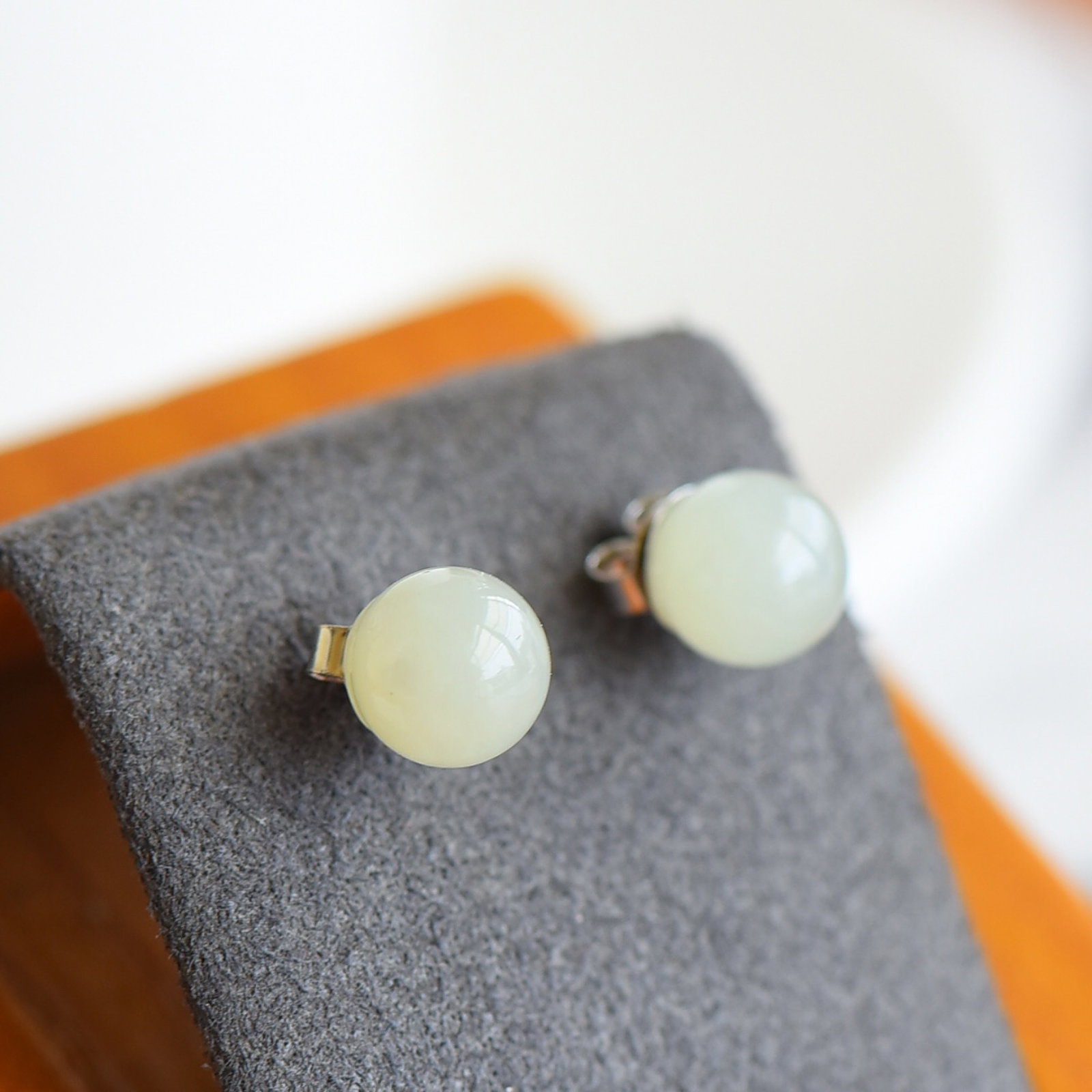 A Pair of Exquisite Sterling Silver Inlaid White Jade Earrings: A Pair of Sterling Silver Inlaid White Jade Earring , Size :8mmx8mms 一对纯银镶白玉耳钉,尺寸:8mmx8mm