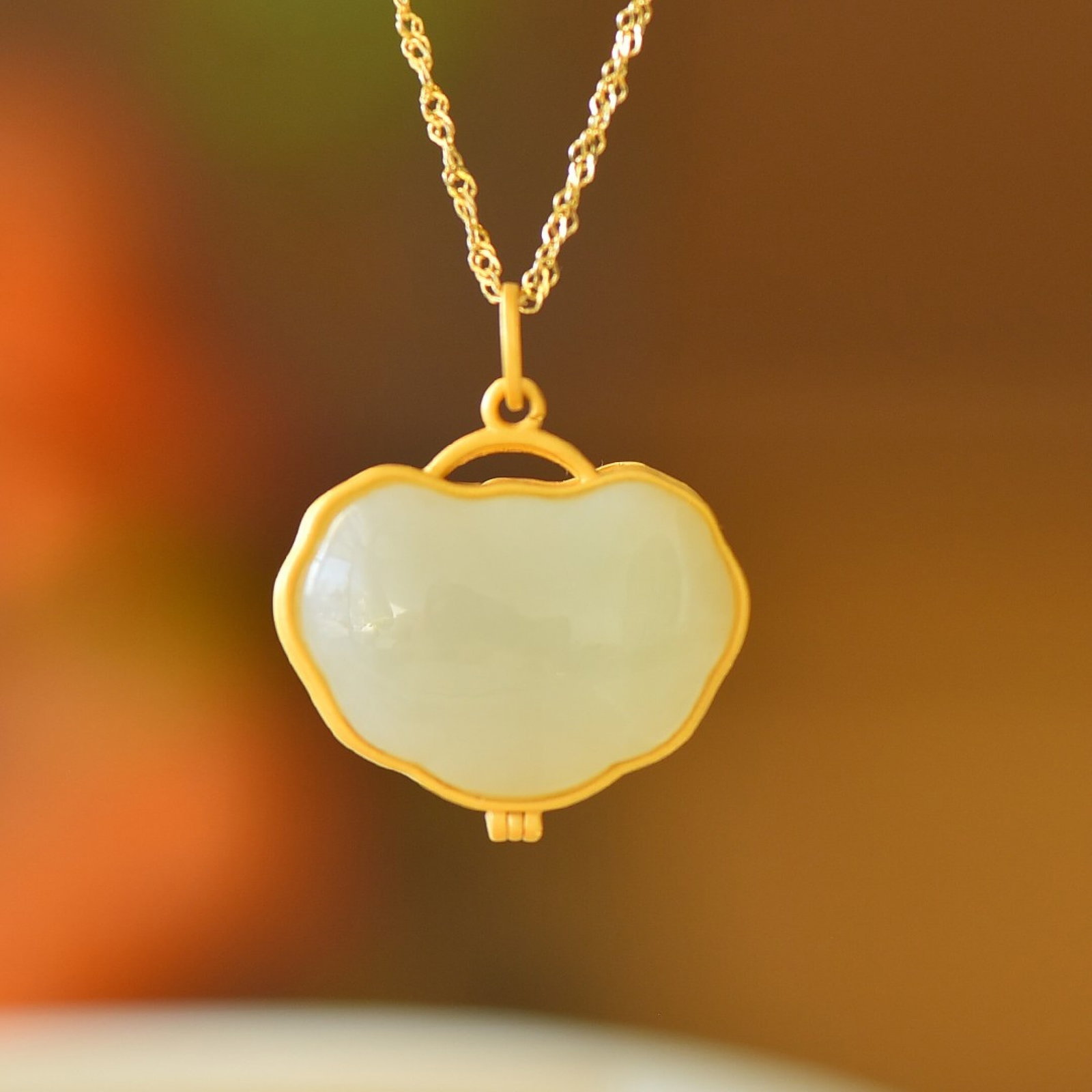 An Exquisite Sterling Silver-Gold Plated Inlaid White Jade Pendant: An Exquisite Sterling Silver-Gold Plated Inlaid White Jade Pendant 纯银镀金镶白玉吊坠