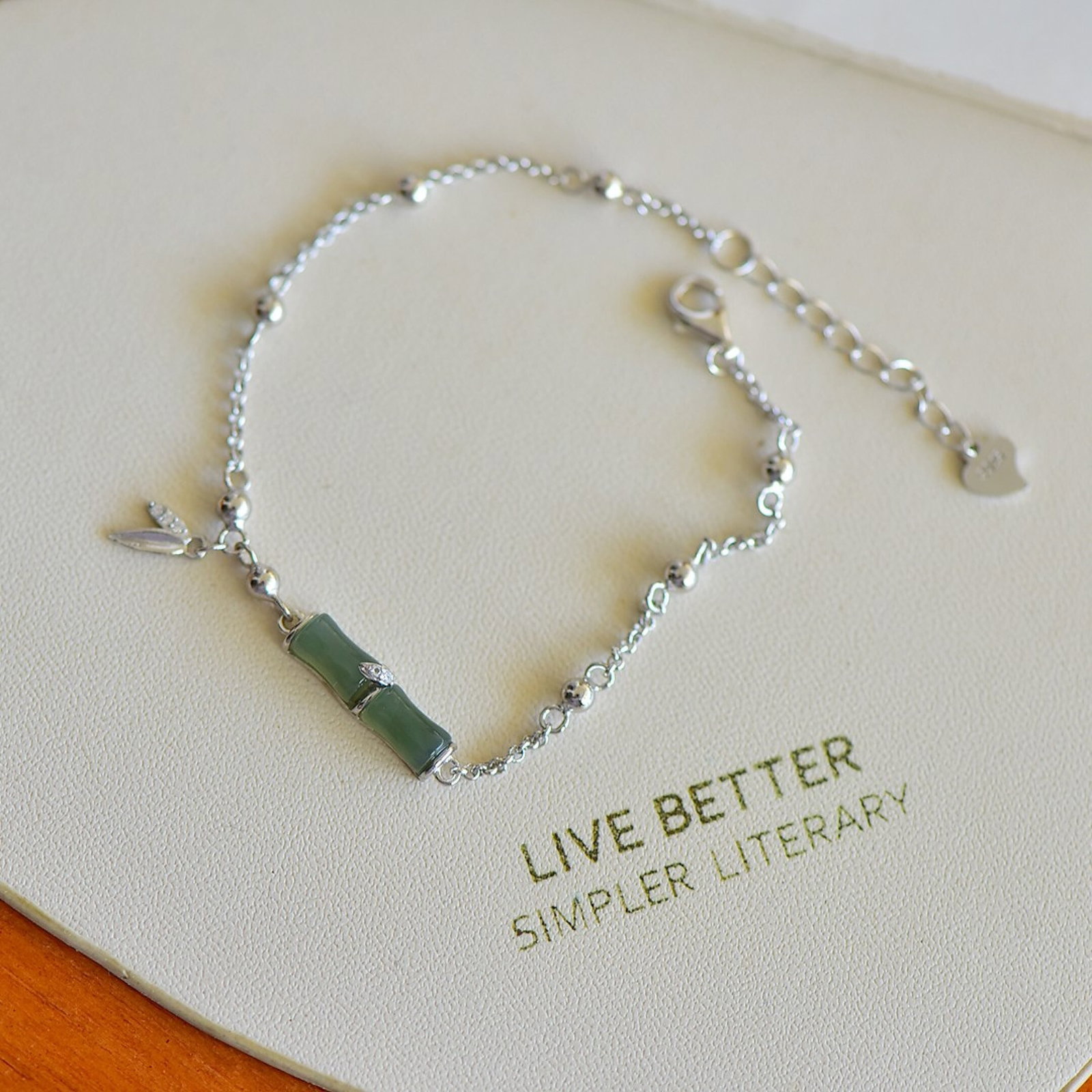 An Exquisite Sterling Silver Inlaid Greenish Jade Bracelet: An Exquisite Sterling Silver Inlaid Greenish Jade Bracelet,Size:4mmx7mm 纯银镶青白玉手链