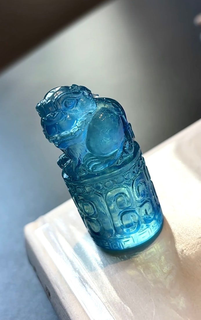An Exquisite Aquamarine Auspicious Beast Pattern Seal: An Exquisite Aquamarine Auspicious Beast Pattern Seal,Size:50mmx24mmx21mm,Weight:41.5g 海蓝宝瑞兽纹印章