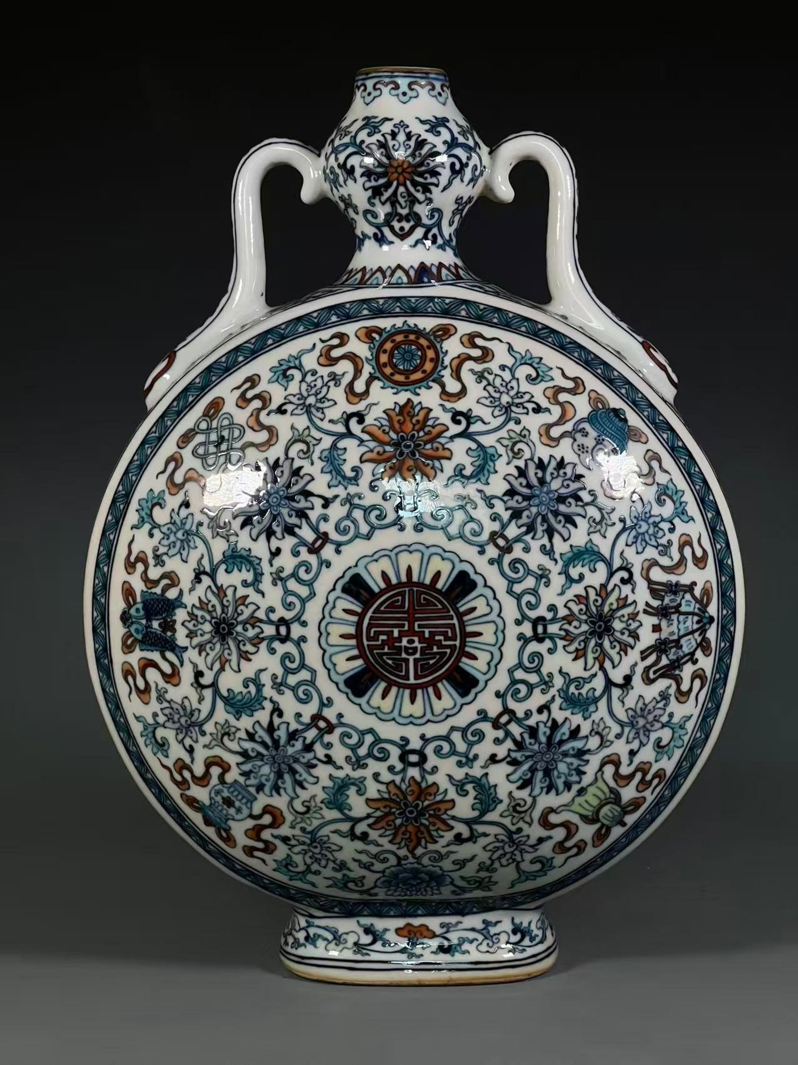 An Exquisite Blue and White Doucai Painted Gold Lotus and Eight Treasures Pattern Double-Ears Vase: An Exquisite Blue and White Doucai Painted Gold Lotus and Eight Treasures Pattern Double-Ears Vase,Qing Dynasty,China,Qianlong Six-character Mark,Size:16.7inx1.5inx5.1in 青花斗ঊ