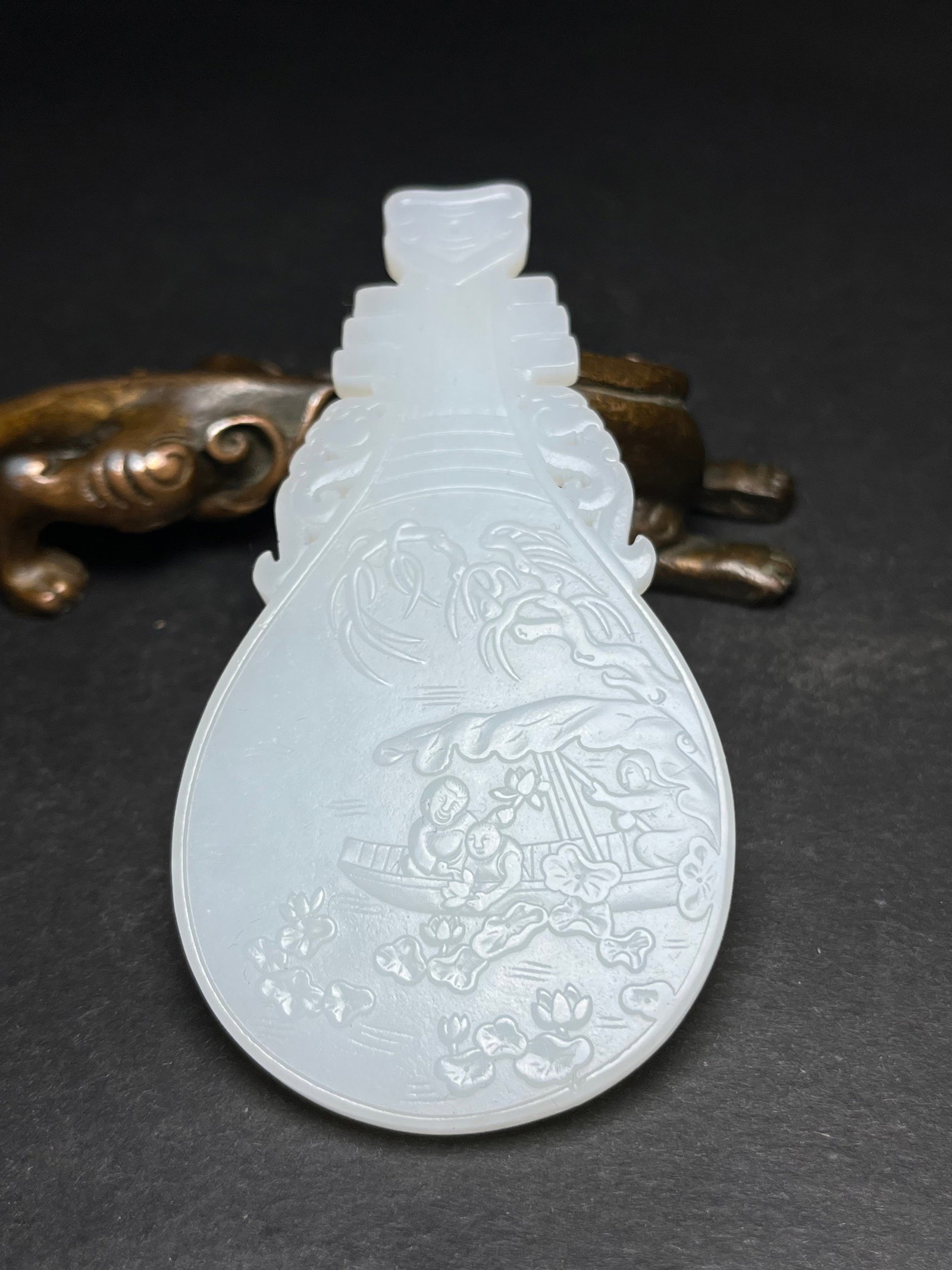 An Exquisite White Jade Landscape and Figure Pattern Pendant,With Poem: An Exquisite White Jade Landscape and Figure Pattern Pendant,With Poem,Qing Dynasty,China,Size:89mmx4mmx46mm,Weight:31g 白玉山水人物纹挂件,带