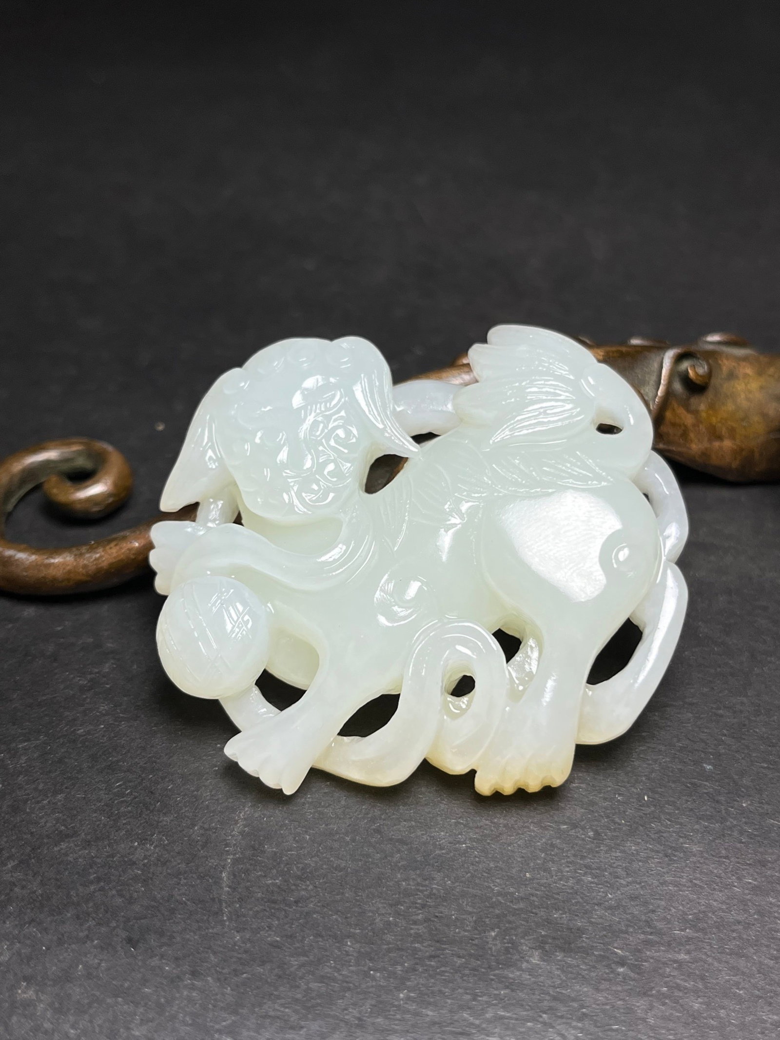 An Exquisite White Jade Lion Pendant (1 of 7)