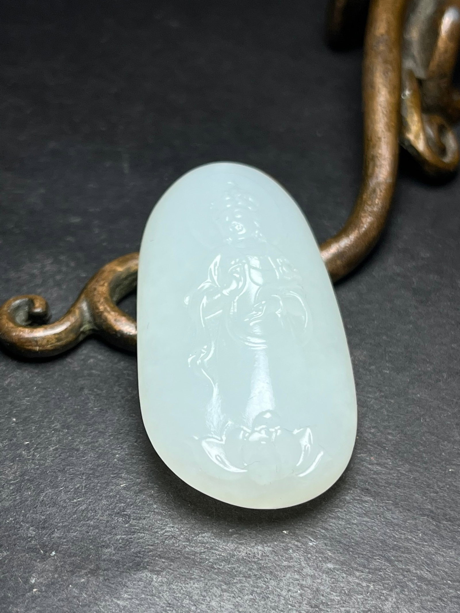 An Exquisite White Jade Statue of Avalokitesvara Pattern Pendant: An Exquisite White Jade Statue of Avalokitesvara Pattern Pendant,Qing Dynasty,China,Size:52mmx14mmx25mm,Weight:29g 白玉观音像纹挂件,中国