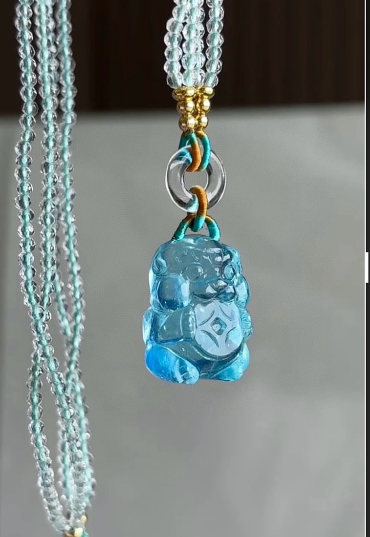 An Exquisite Aquamarine Auspicious Beast Pendant: An Exquisite Aquamarine Auspicious Beast Pendant,Size:19mmx15mm,Total Weight:12g 海蓝宝瑞兽吊坠