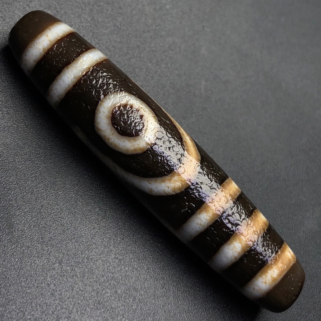 An Exquisite Two Eyes Dzi Bead Pendant: An Exquisite Two Eyes Dzi Bead Pendant,Size:58mmx12mm,Weight:13.2g 两眼天珠挂件