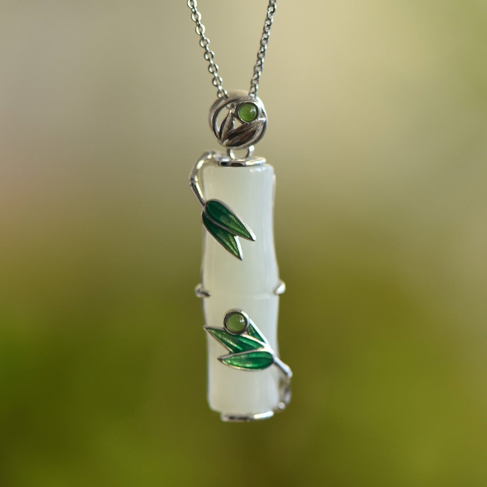 An Exquisite Sterling Silver Inlaid White Jade Pendant: An Exquisite Sterling Silver Inlaid White Jade Pendant 纯银镶白玉吊坠