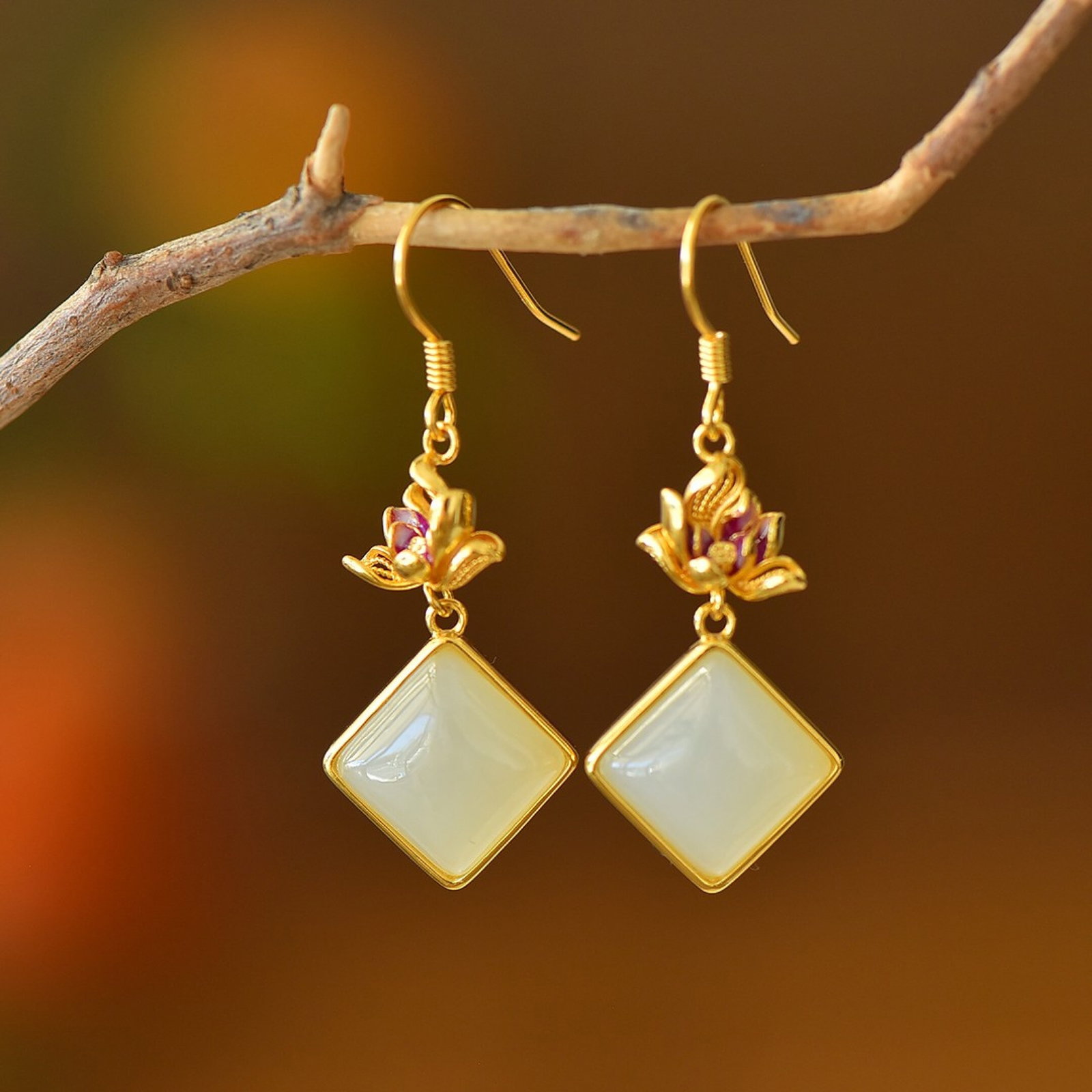 A Pair of Exquisite Sterling Silver-Gold Plated Inlaid White Jade Earrings: A Pair of Exquisite Sterling Silver-Gold Plated Inlaid White Jade Earrings 一对纯银镀金镶白玉耳环