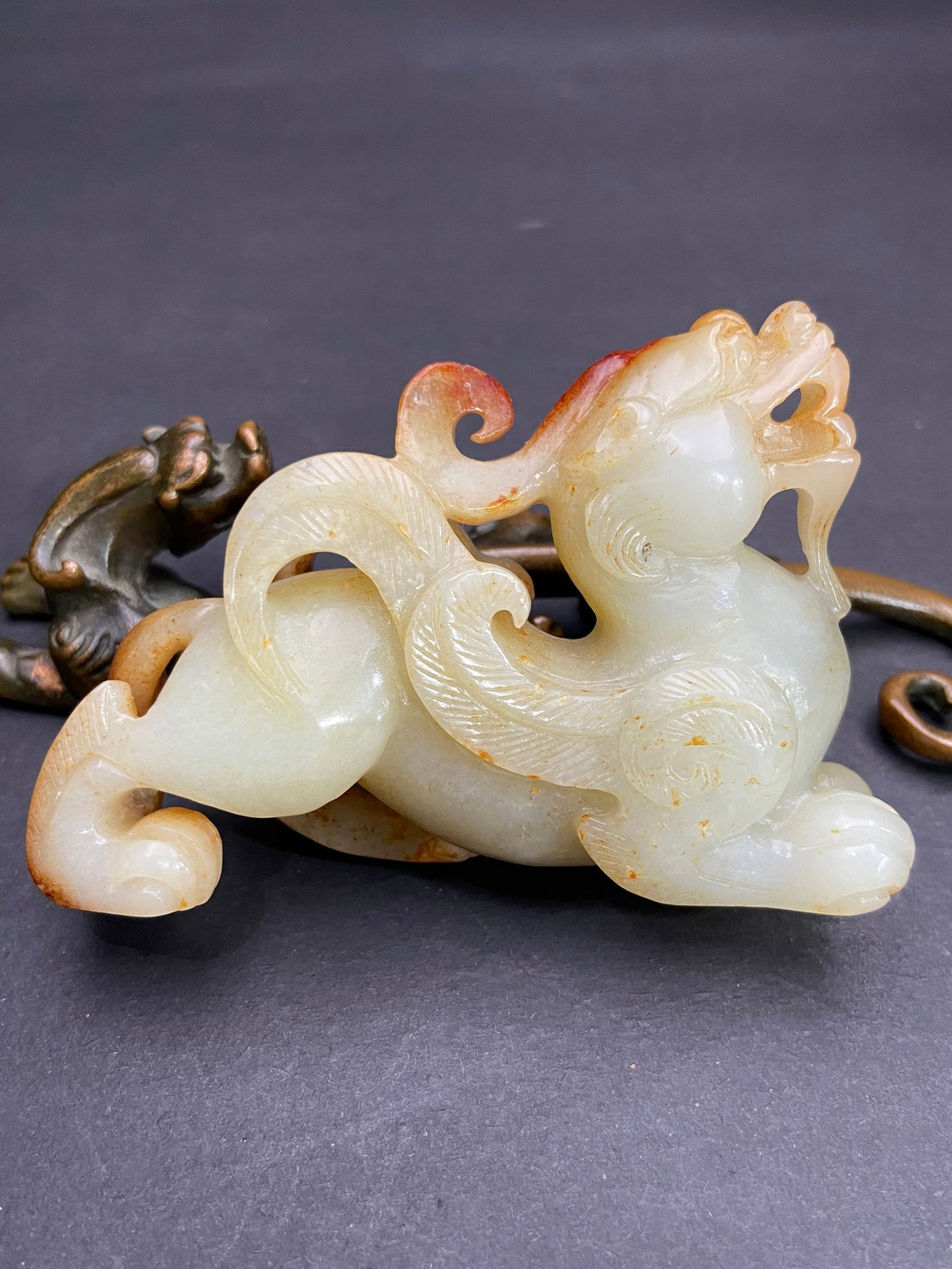 An Exquisite White Jade Auspicious Beast Hand Piece: An Exquisite White Jade Auspicious Beast Hand Piece,Qing Dynasty,China,Size:85mmx57.6mmx26.8mm,Weight:138g 白玉瑞兽手把件,中国清代
