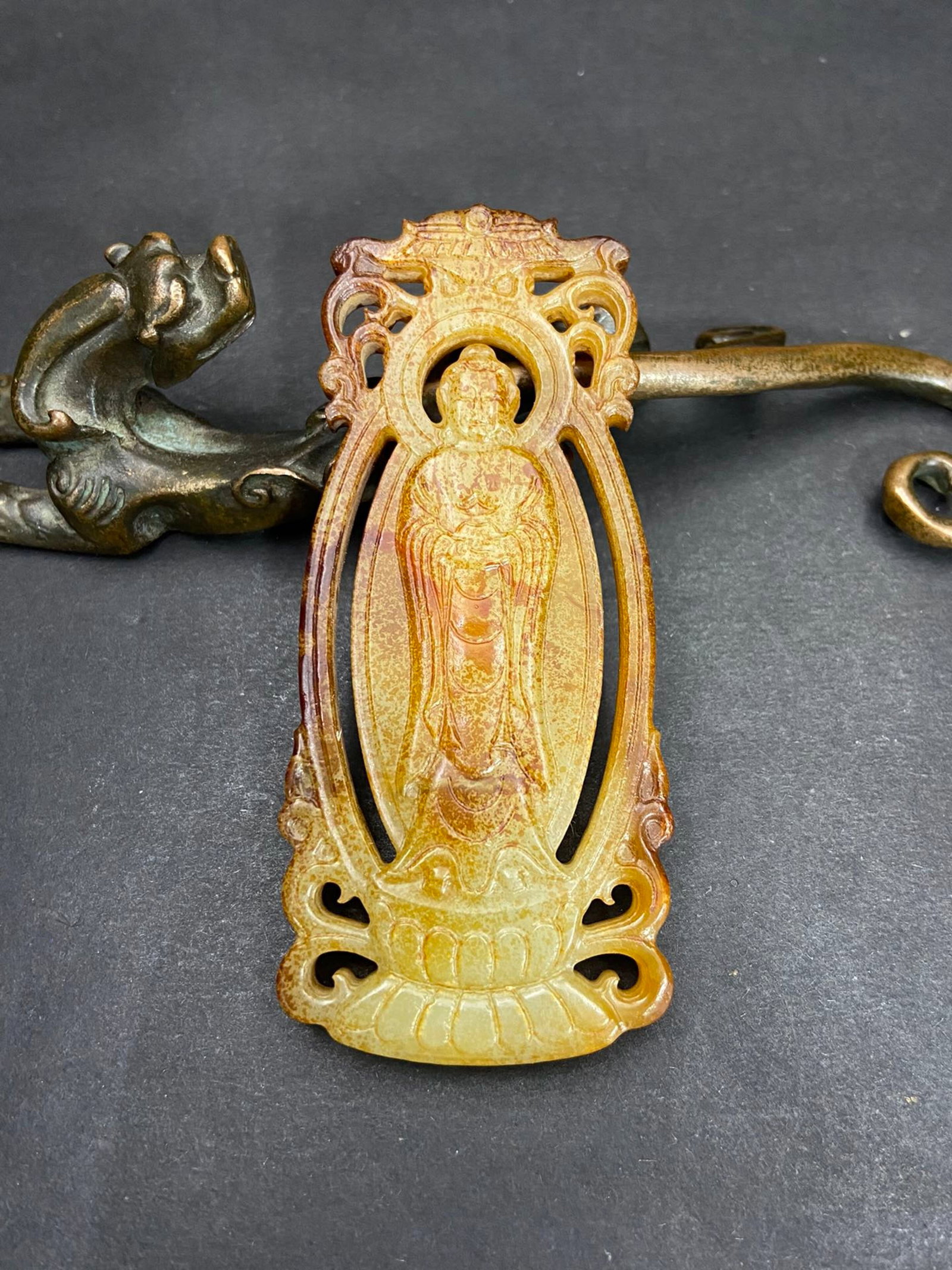 An Exquisite White Jade Statue of Mah?vairocana Pendant: An Exquisite White Jade Statue of Mahāvairocana Pendant,Qing Dynasty,China,Size:89.6mmx40mmx7.2mm,Weight:44g