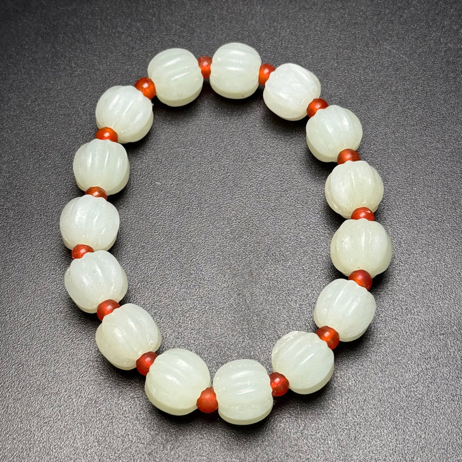 An Exquisite White Jade Pumpkin-Shaped Bracelets: An Exquisite White Jade Pumpkin-Shaped Bracelets,Qing Dynasty,China,Size:13mmx12mm,Total Weight:51g 白玉南瓜形手串,中国清代