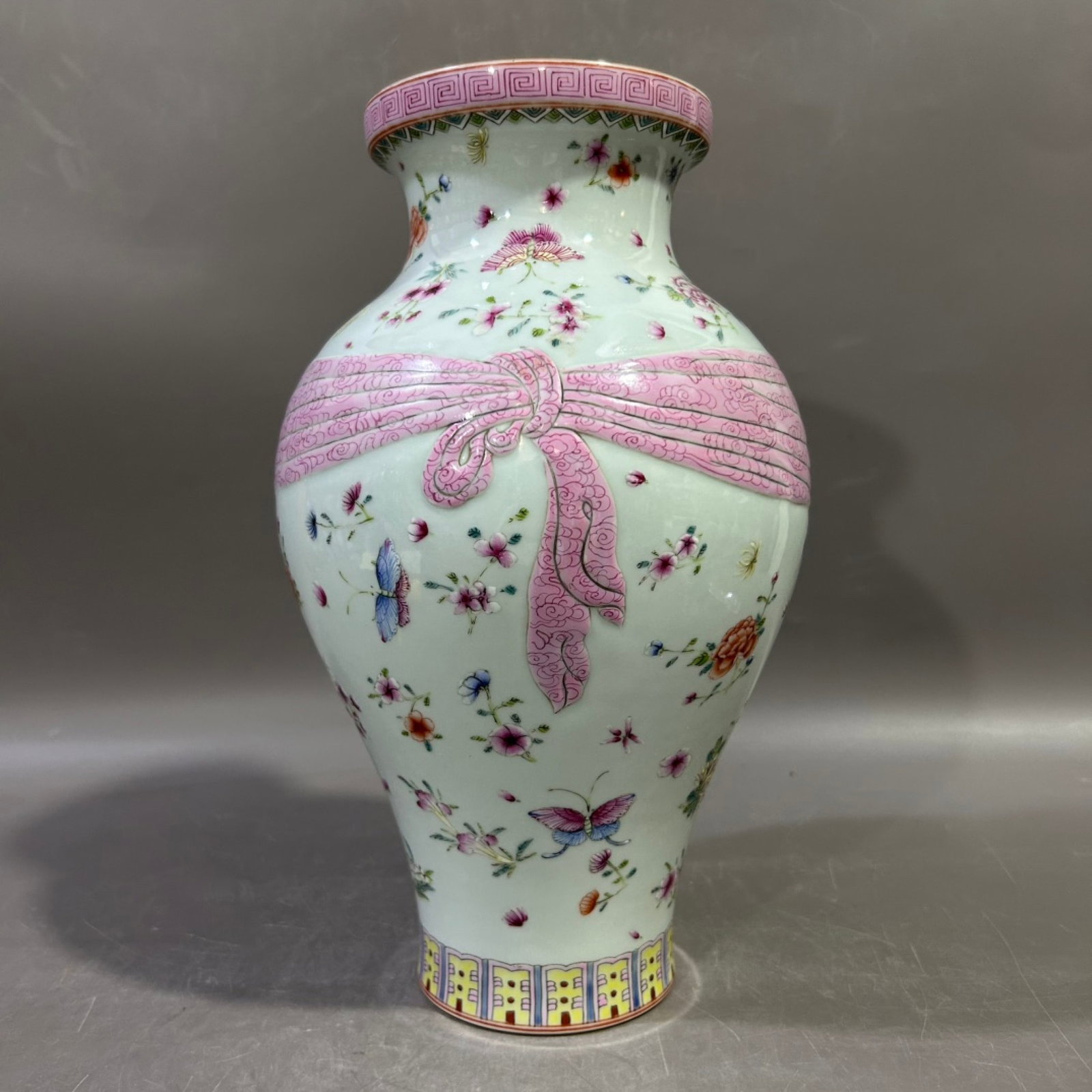 A Rare Famille-Rose Painted Gold Flower and Butterfly Pattern Vase: A Rare Famille-Rose Painted Gold Flower and Butterfly Pattern Vase,Qing Dynasty,China,Qianlong Six-character Mark,Size:11.8inx5.9in 粉彩描金花卉蝴蝶 