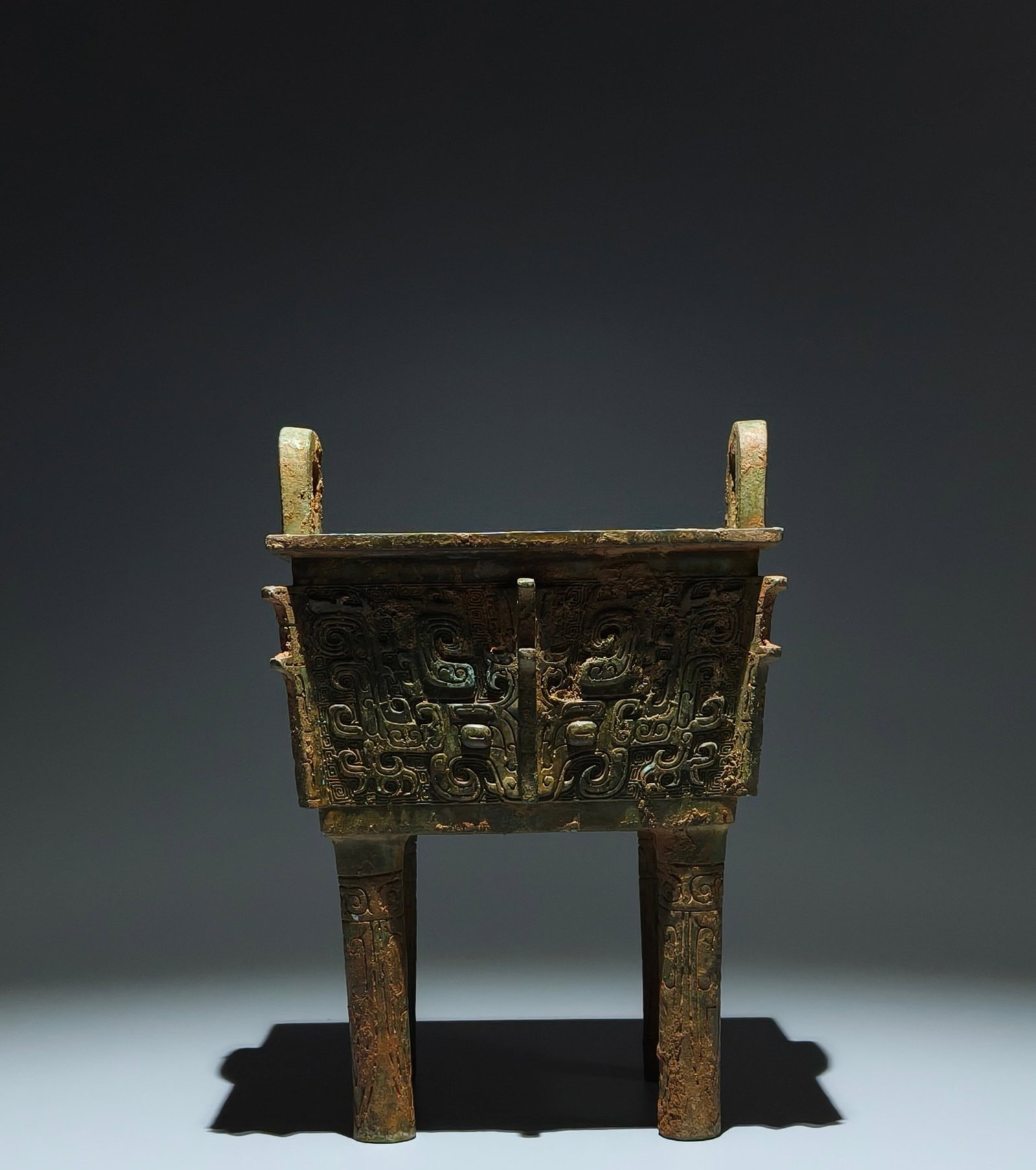 An Archaic Bronze Beast-Face Pattern Double-Ears four legs Censer,With Inscription: An Archaic Bronze Beast-Face Pattern Double-Ears four legs Censer,With Inscription,Shang Dynasty,China,Size:10.4inx7.5inx6.5in 青铜兽面纹双耳四足&