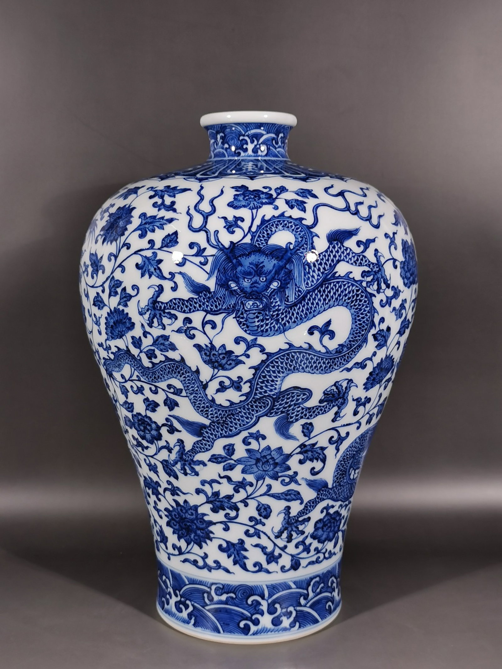 A Rare Blue and White Lotus and Dragon Pattern Vase: A Rare Blue and White Lotus and Dragon Pattern Vase,Qing Dynasty,China,Qianlong Six-character Mark,Size:15.2inx2.8inx9.8in 青花缠枝莲龙纹瓶,中