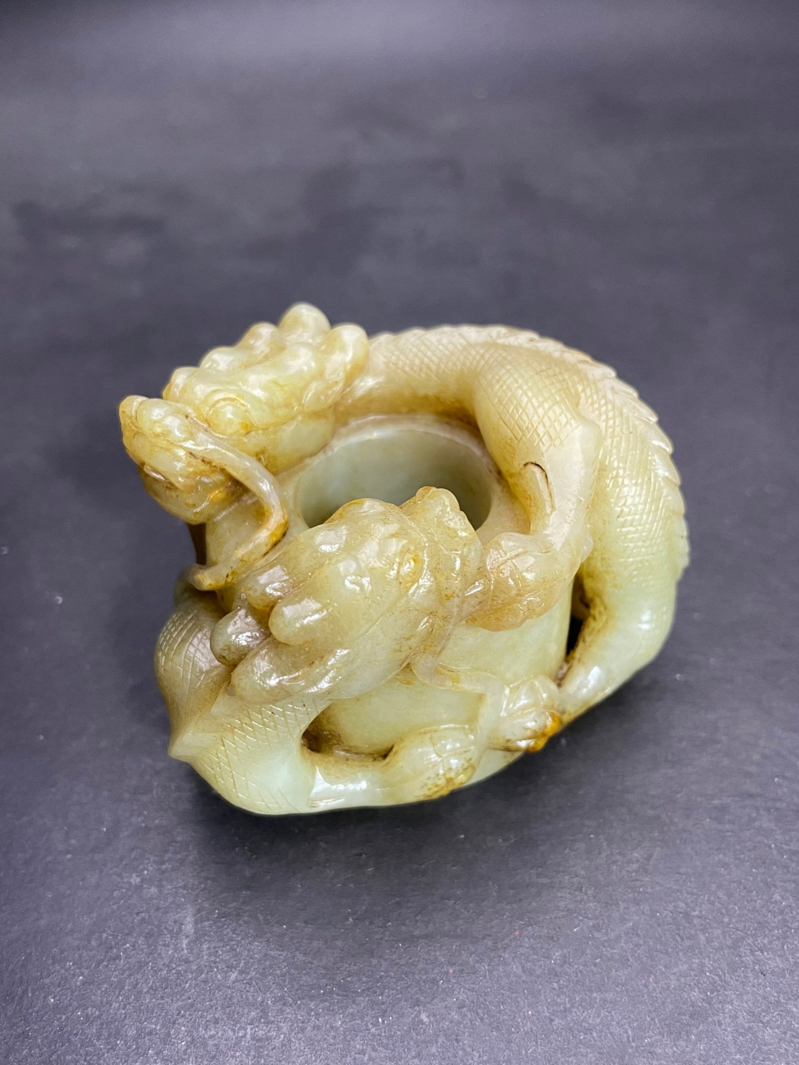 An Exquisite White Jade Dragon Pattern Fingerstall: An Exquisite White Jade Dragon Pattern Fingerstall,Qing Dynasty,China,Size:46.5mmx22.2mm,Weight:200g 白玉龙纹扳指,中国清代